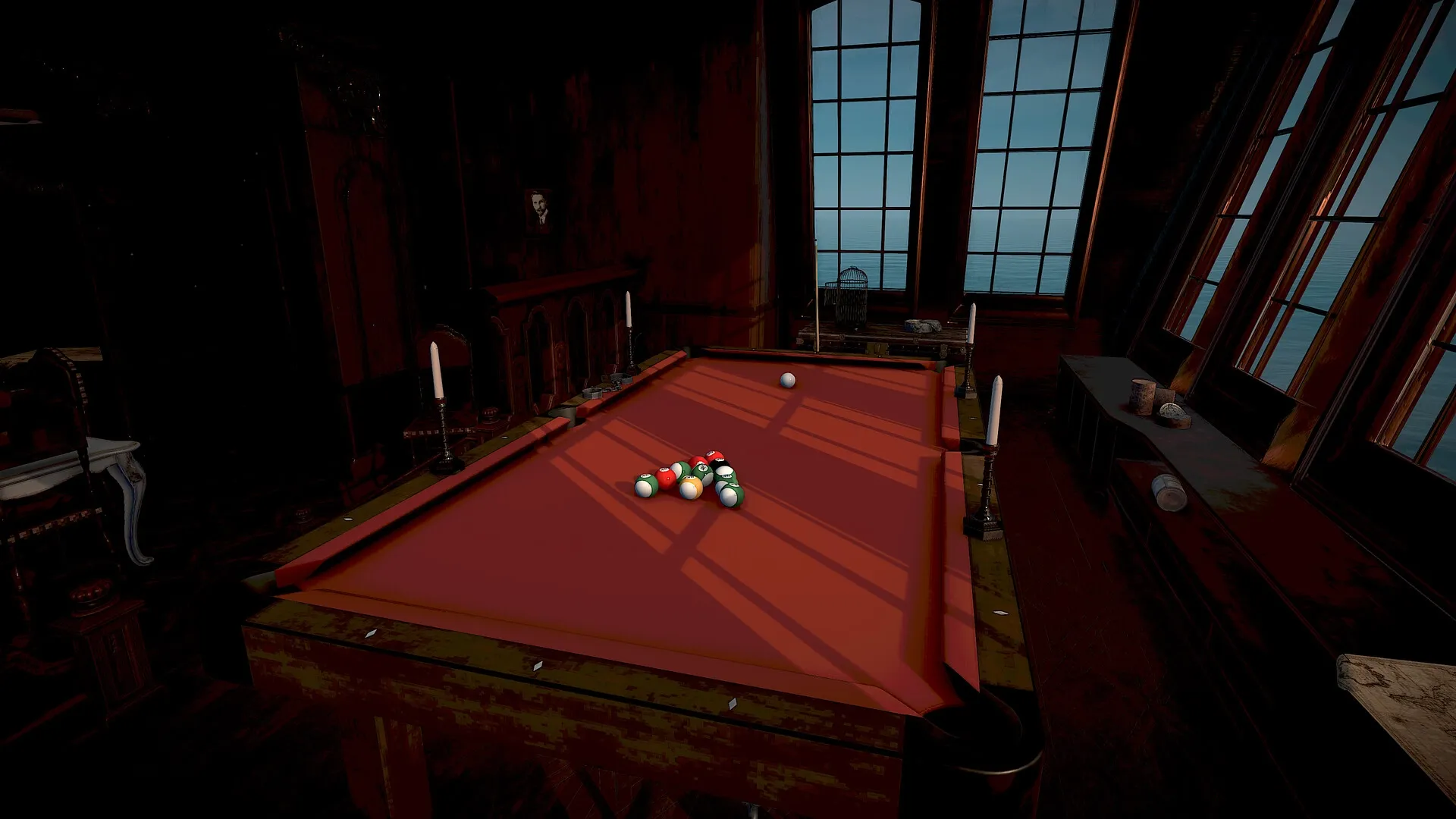 Pool of Madness: Pool table in dimly lit room with candles, portrait, and large windows overlooking sea.