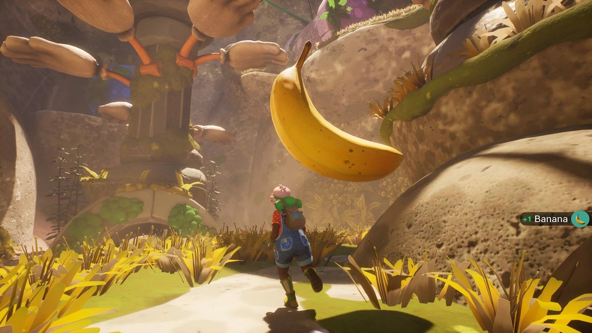 Portabellows: Player runs toward a giant banana pickup in a rocky canyon, +1 Banana UI popup.