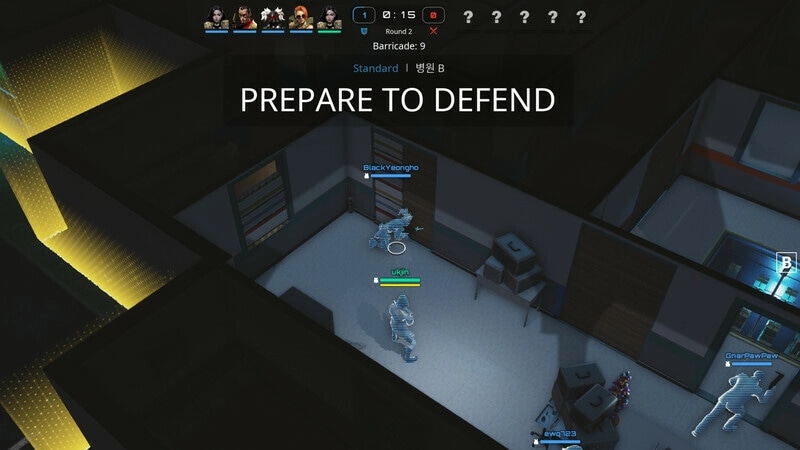 PUBG: Team prepares to defend in a building with strategic barricades and players positioned at doors