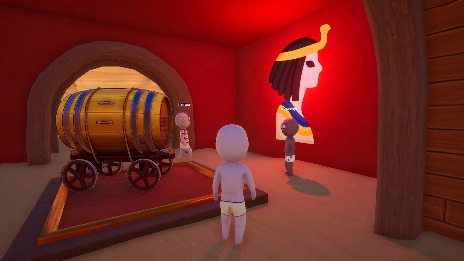 Pull the Beer: Players stand by a wheeled beer barrel cart in a red room with wall mural.