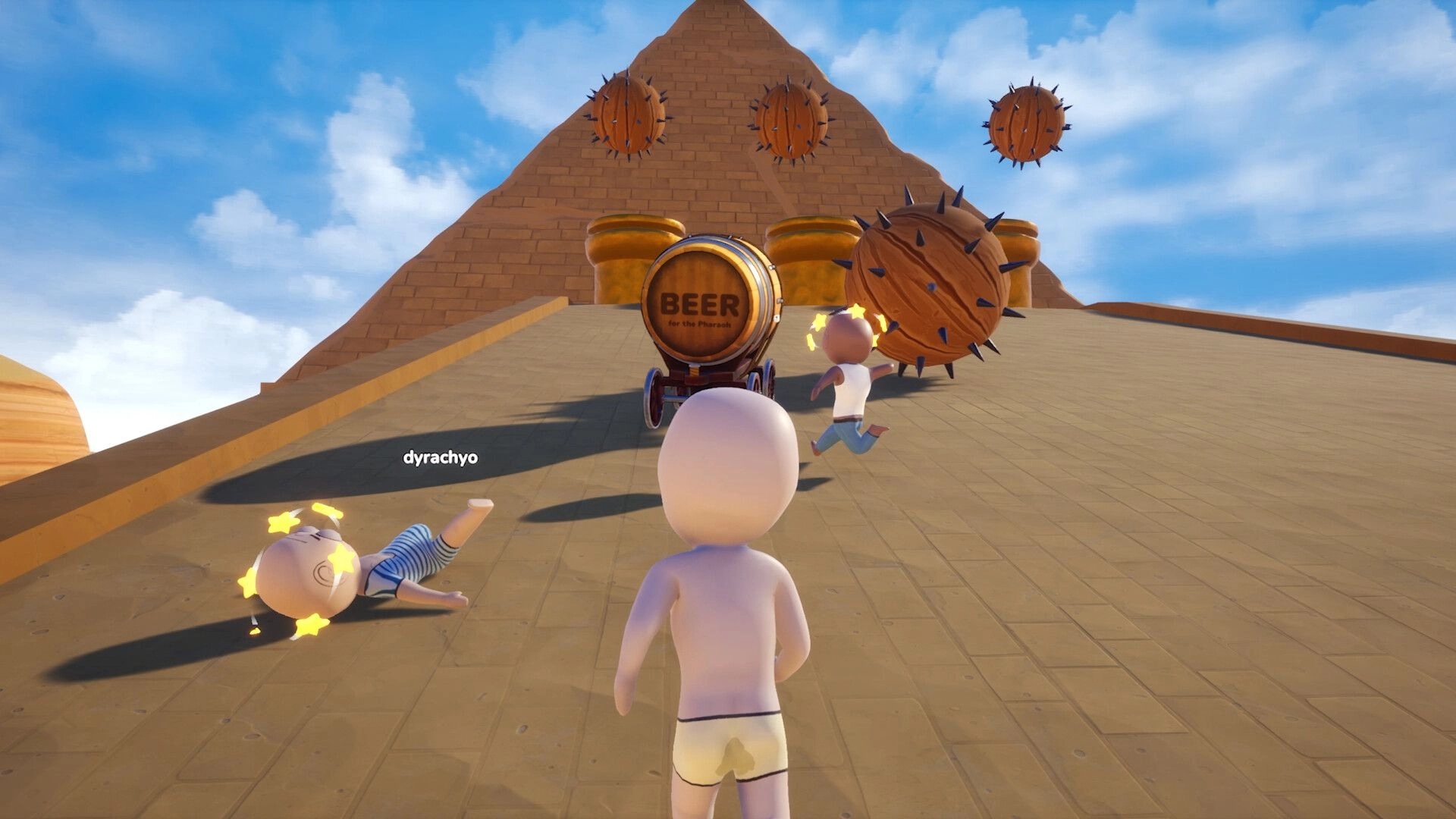 Pull the Beer: Players haul a beer barrel cart up a pyramid ramp while spiked rollers threaten them.