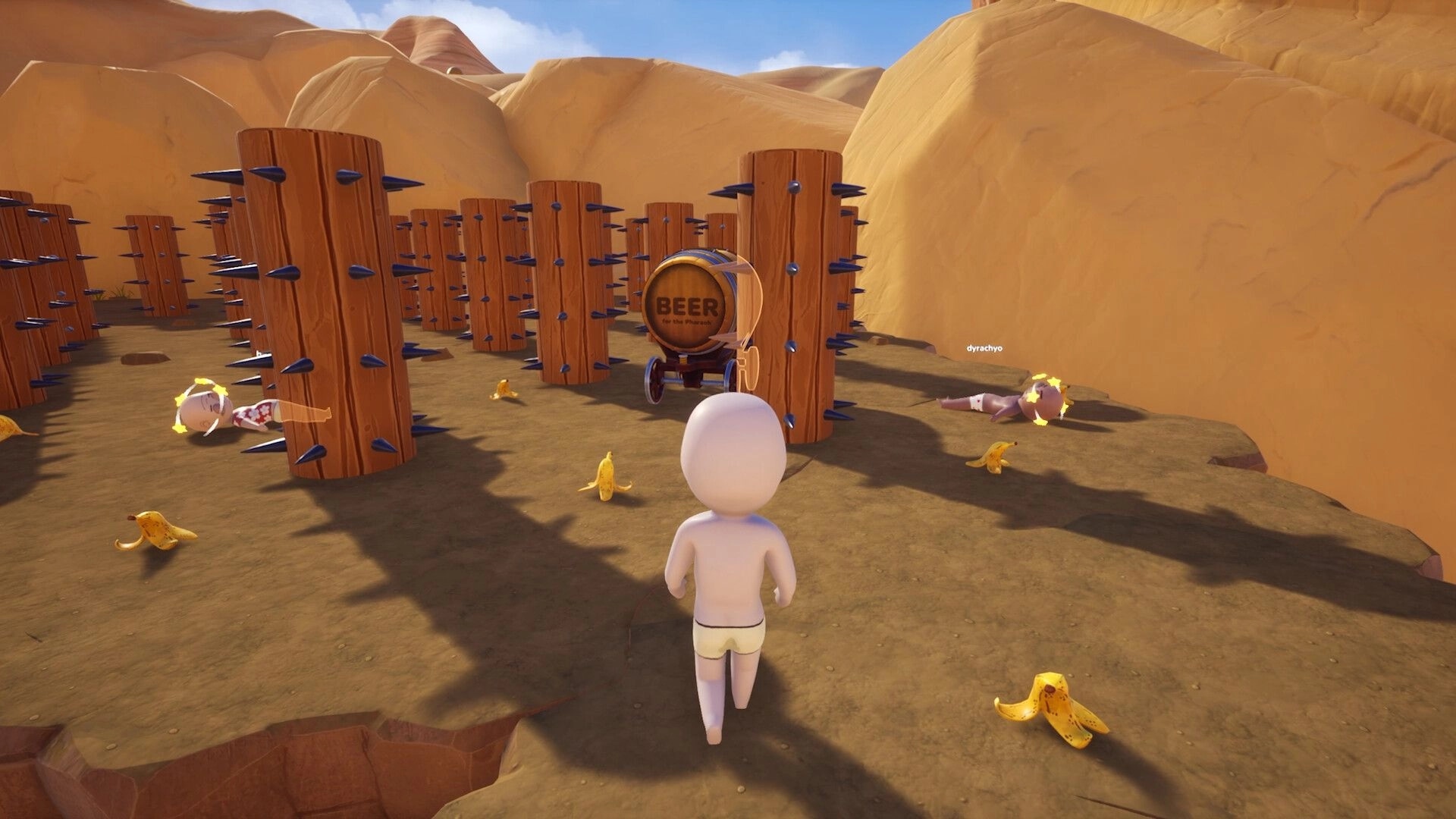 Pull the Beer: Player faces beer barrel cart amid spiked posts and banana peels in desert canyon obstacle course.