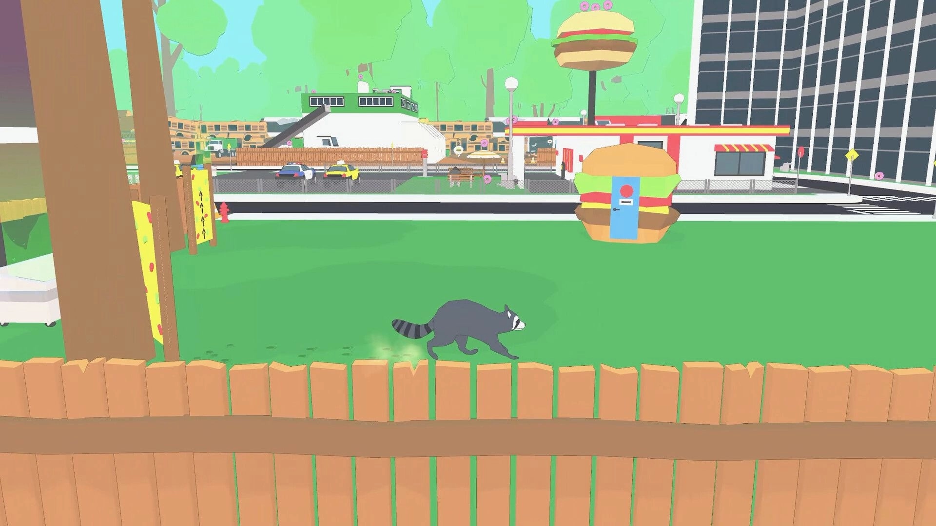 Raccoon Crime Spree: Raccoon sprinting through park near burger joint with cars and buildings visible