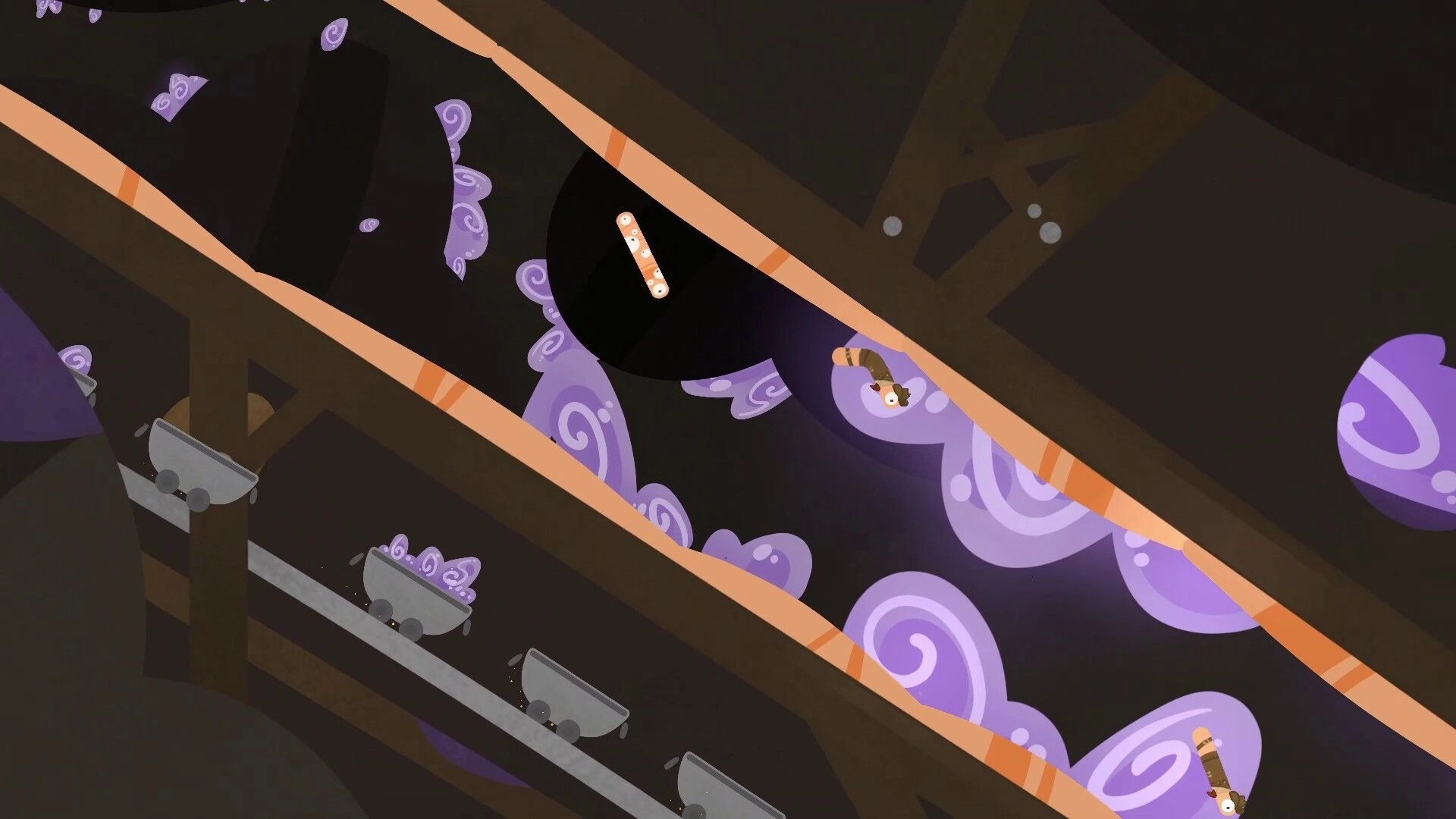 RaceWorms: Worms racing through underground tunnels with purple swirls and wooden mine carts visible