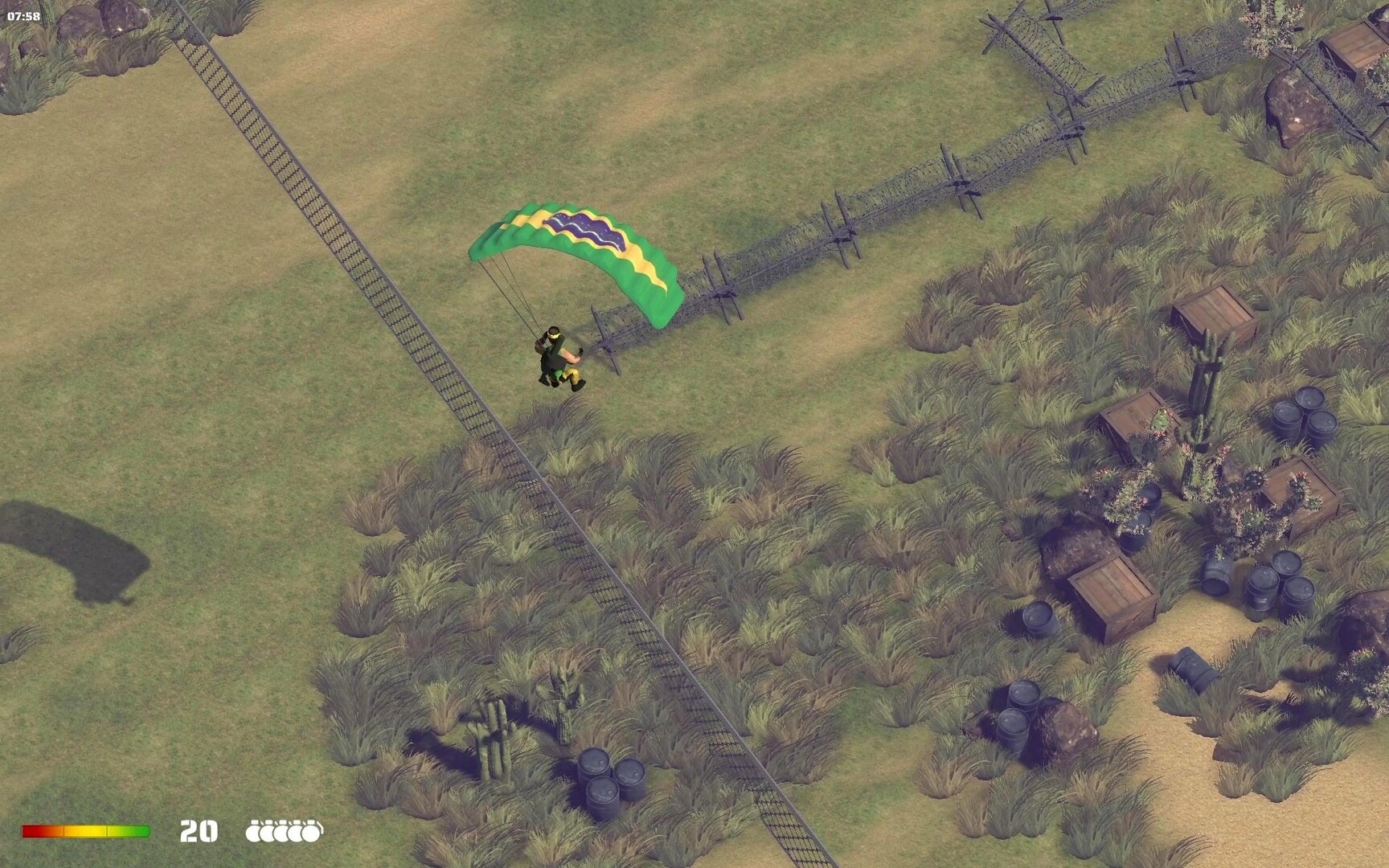 RANGER COMMANDO: Parachuting commando lands near barbed wire in grassy field with crates and barrels scattered.