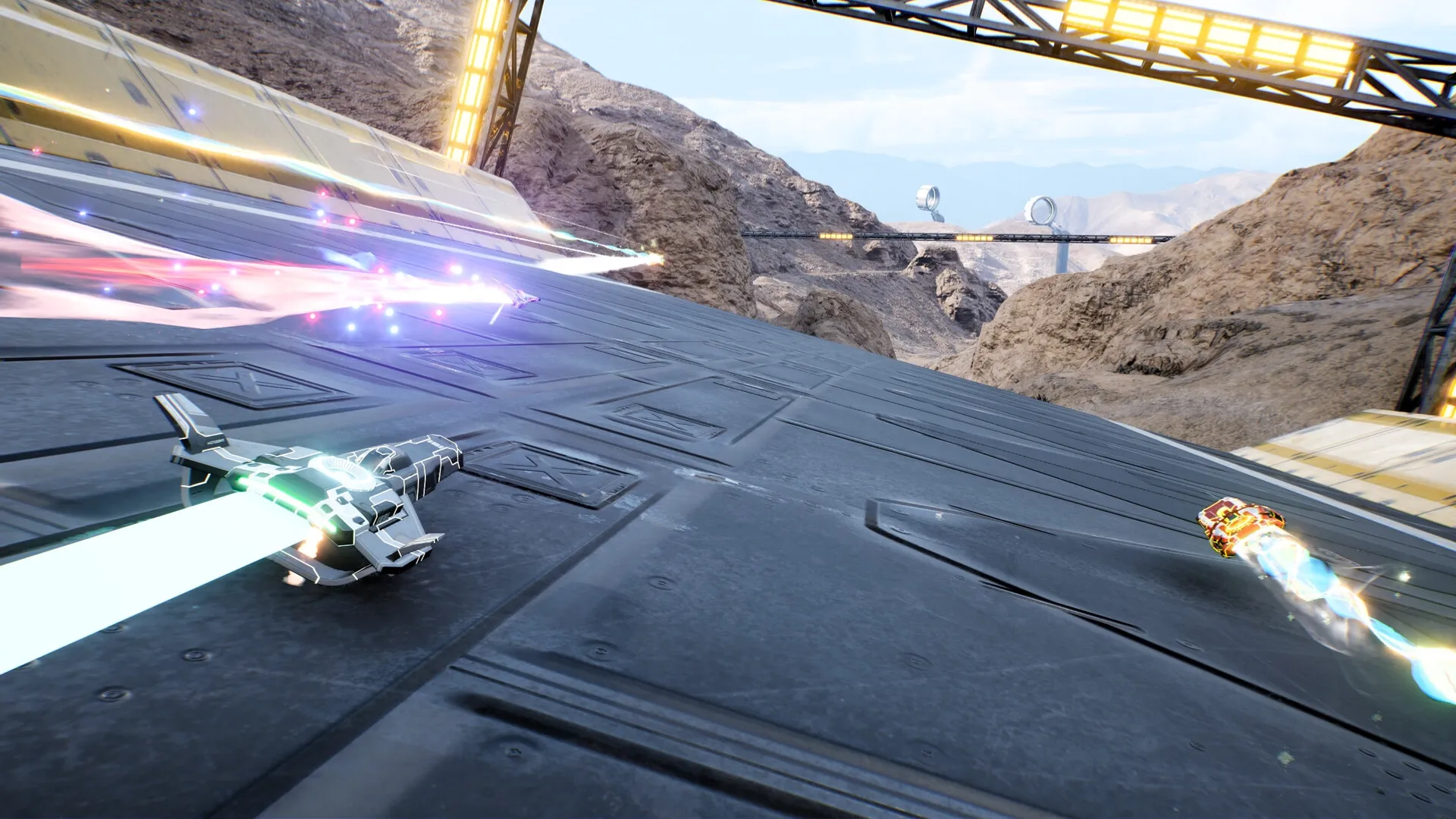 Razorback: High-speed ships racing on a metallic track in a mountainous desert environment