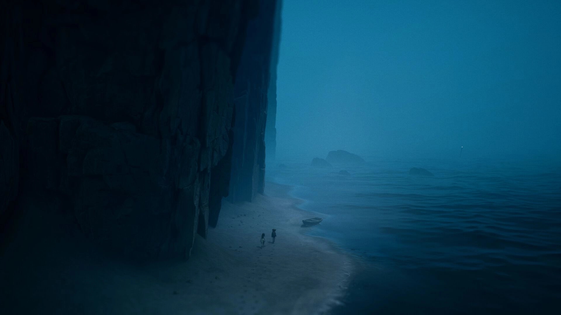 REANIMAL: Two siblings walk on a misty beach beside a towering cliff with a small boat nearby