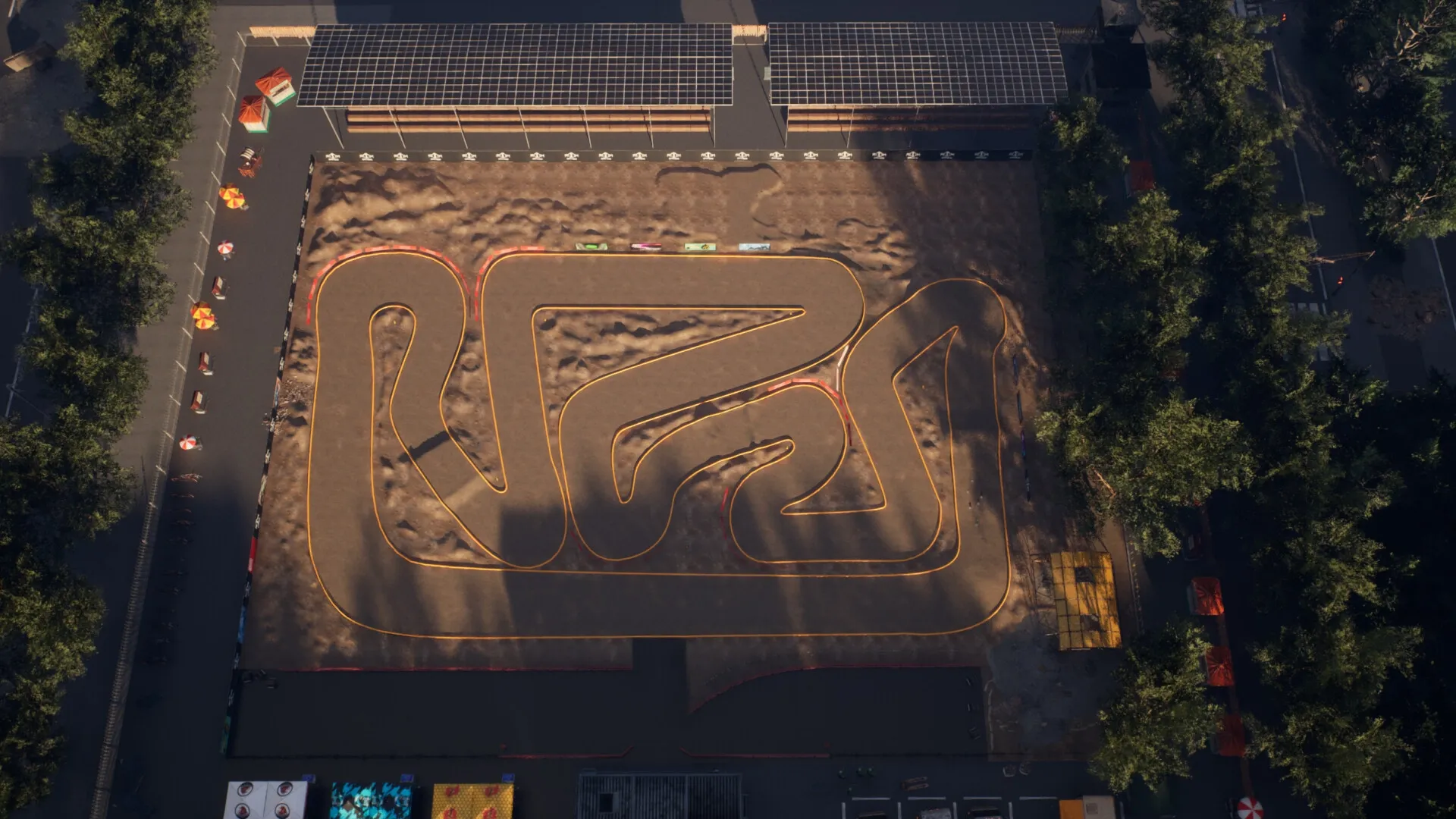 Recharge: Aerial view of a winding RC racetrack surrounded by trees and spectator stands