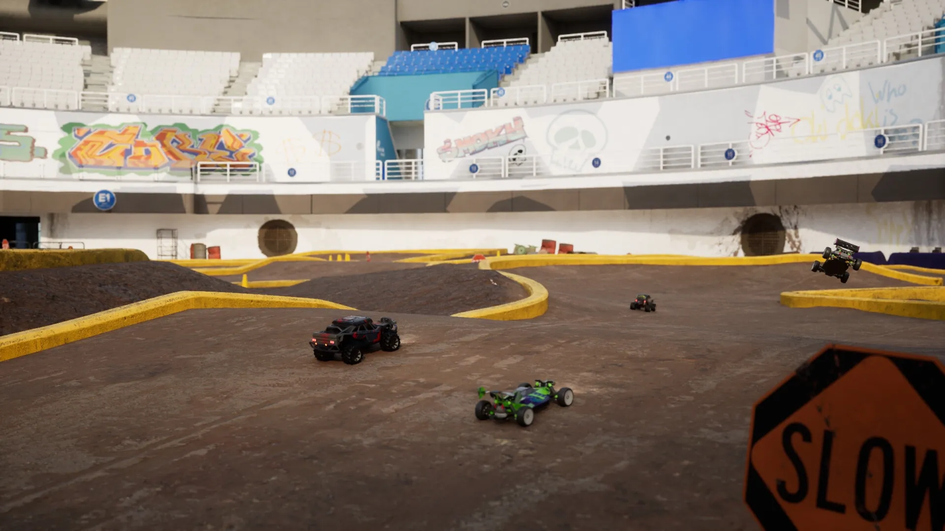 Recharge: RC cars racing on a stadium dirt track with graffiti and a "SLOW" sign visible