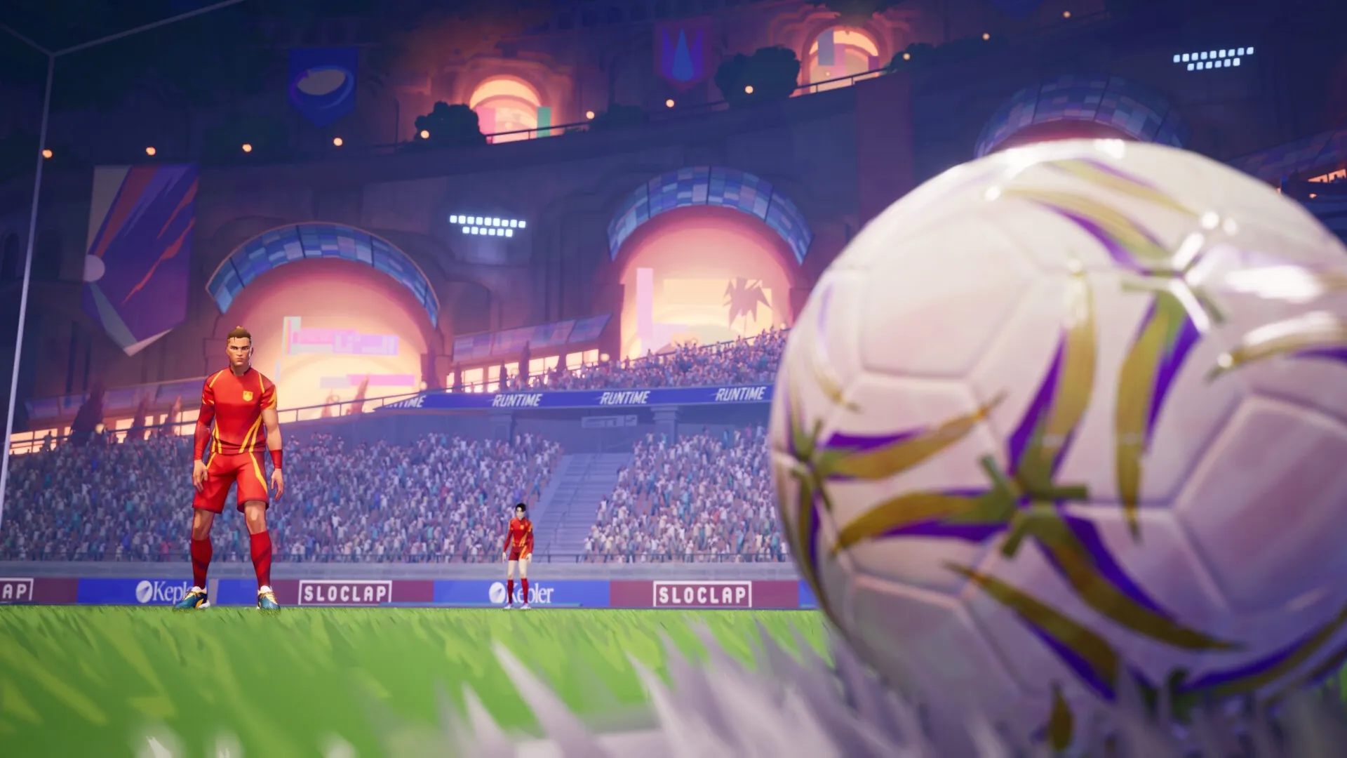REMATCH: Player in red kit stands on vibrant stadium field with giant ball and packed stands in background