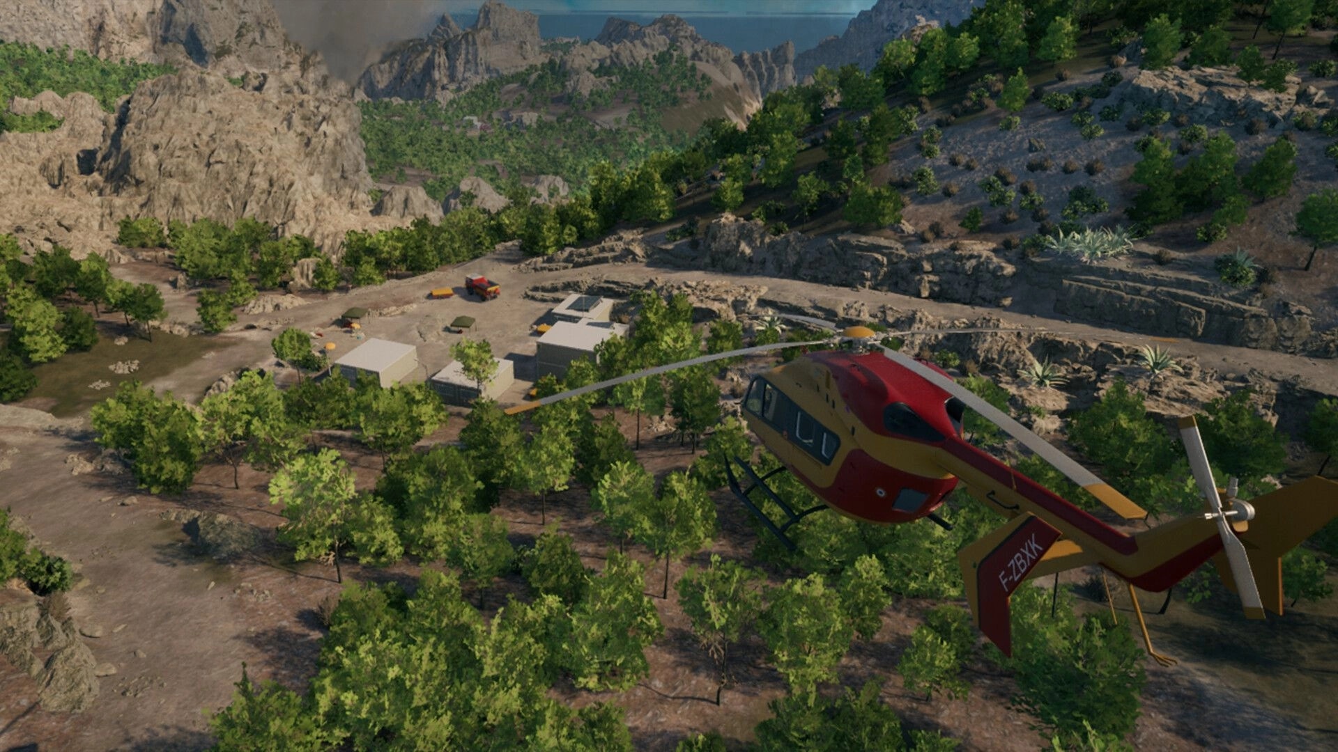 Rescue Ops: Helicopter flying over a remote base camp with trucks and tents in rocky forest valley.