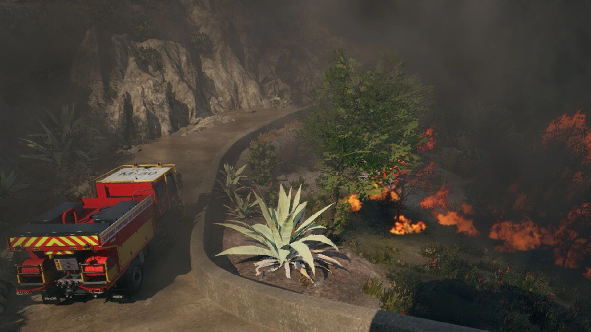 Rescue Ops: Fire engine driving past burning brush and smoke on a winding mountain roadside.