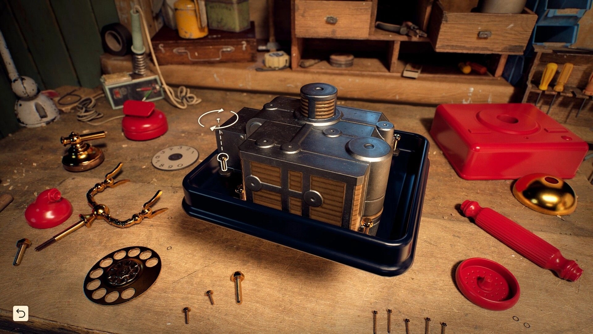 Reshine: Rotating a metal phone base in a tray on a cluttered workbench with parts and tools.