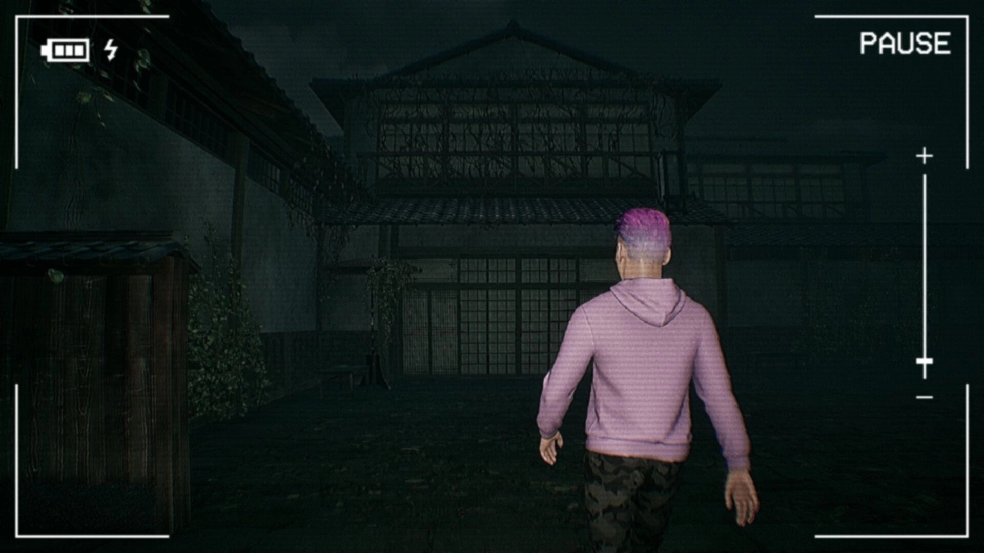 Road to Jukai: Character in purple hoodie walks toward dark house, paused camera UI at night.