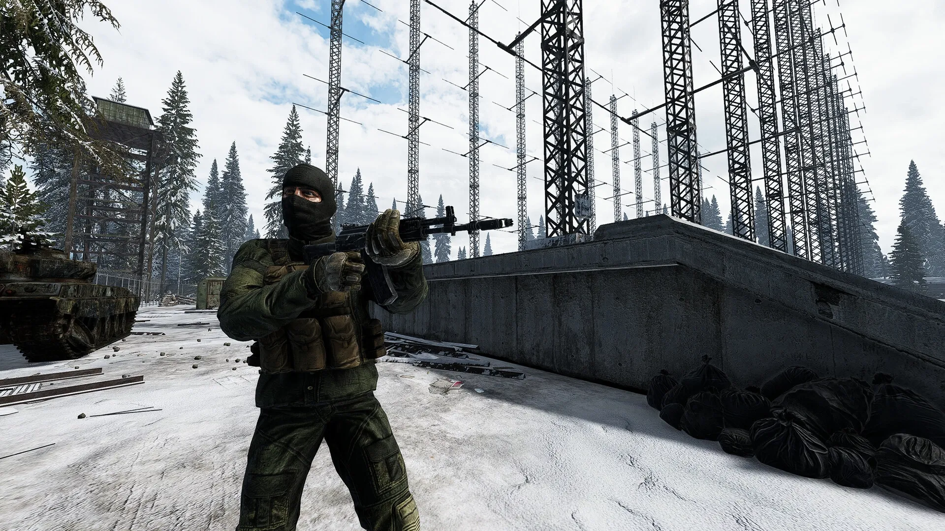 Road to Vostok: Armed soldier stands in snowy forest near abandoned military structures and radio towers.