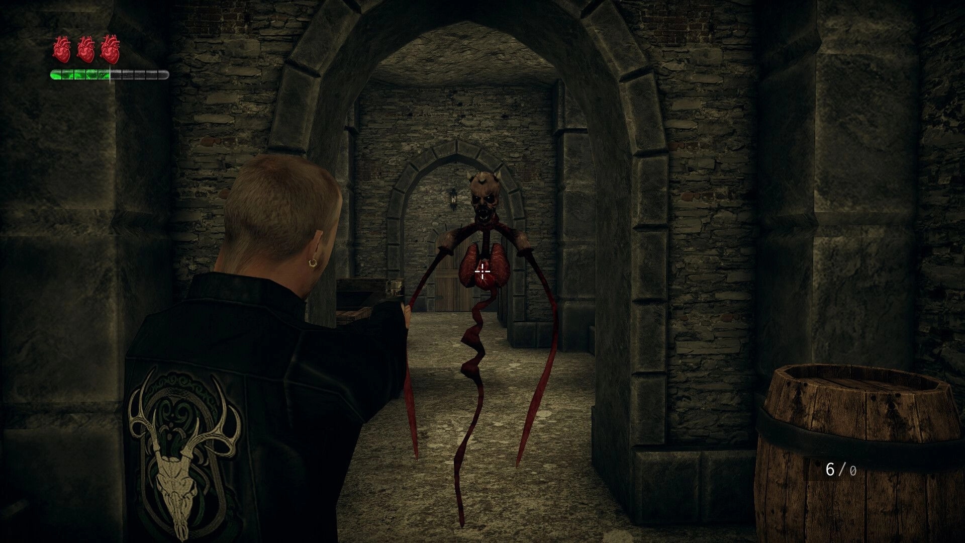 Rogue Mansion: Player aiming at a grotesque floating creature in a dimly lit stone corridor.