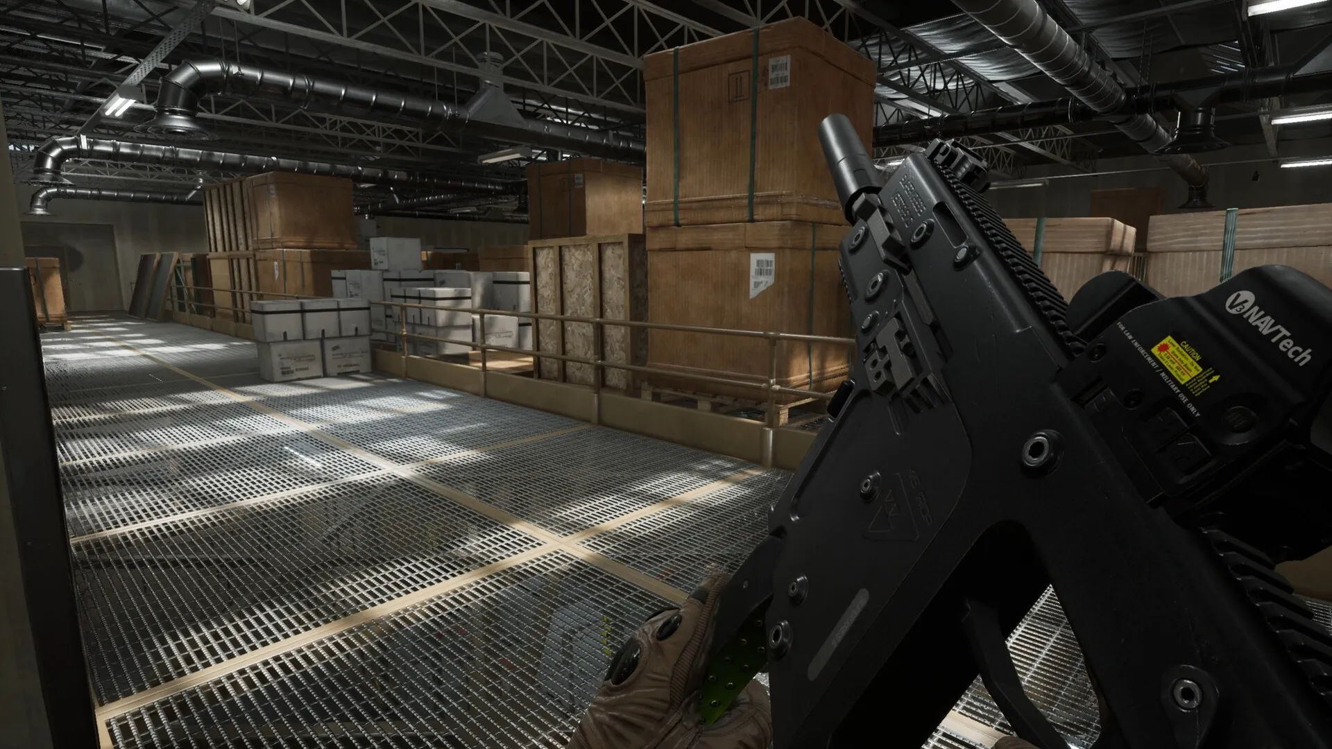 Rogue Point: Player holds rifle in a warehouse with stacked crates and metal walkways illuminated above.