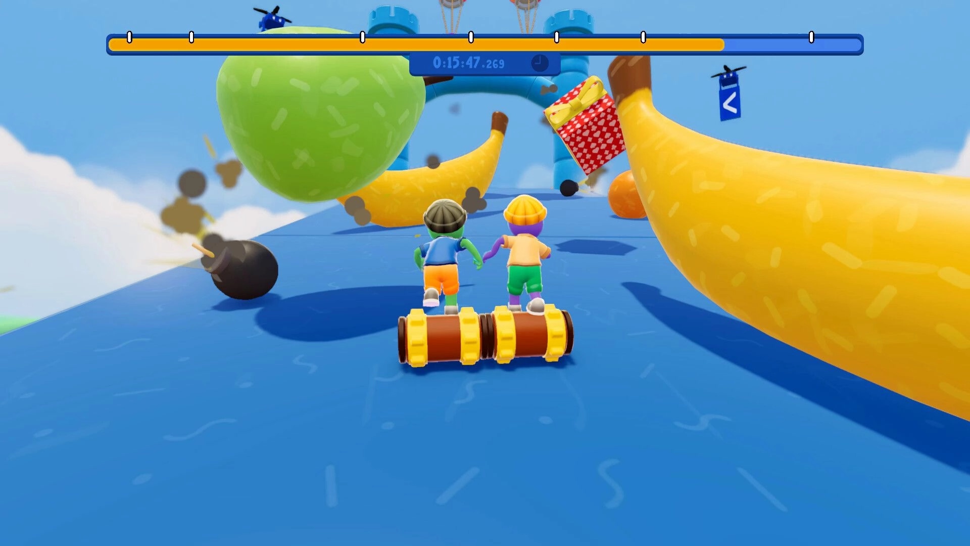 Roll Together: Two players roll a cylinder uphill past bombs and giant bananas on a sky obstacle course.