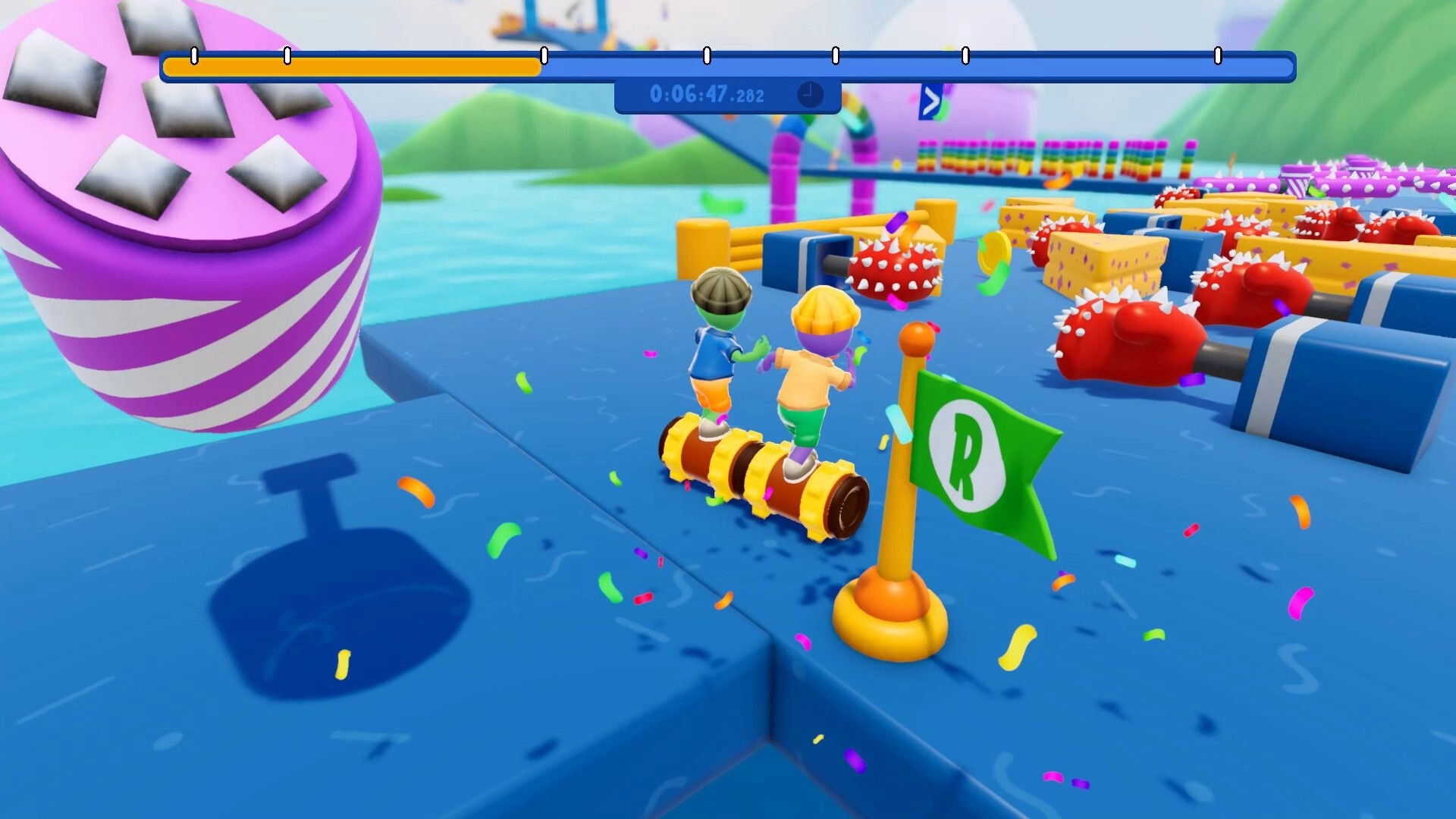 Roll Together: Two players balance on a rolling cylinder past spiked rollers on a colorful obstacle course.