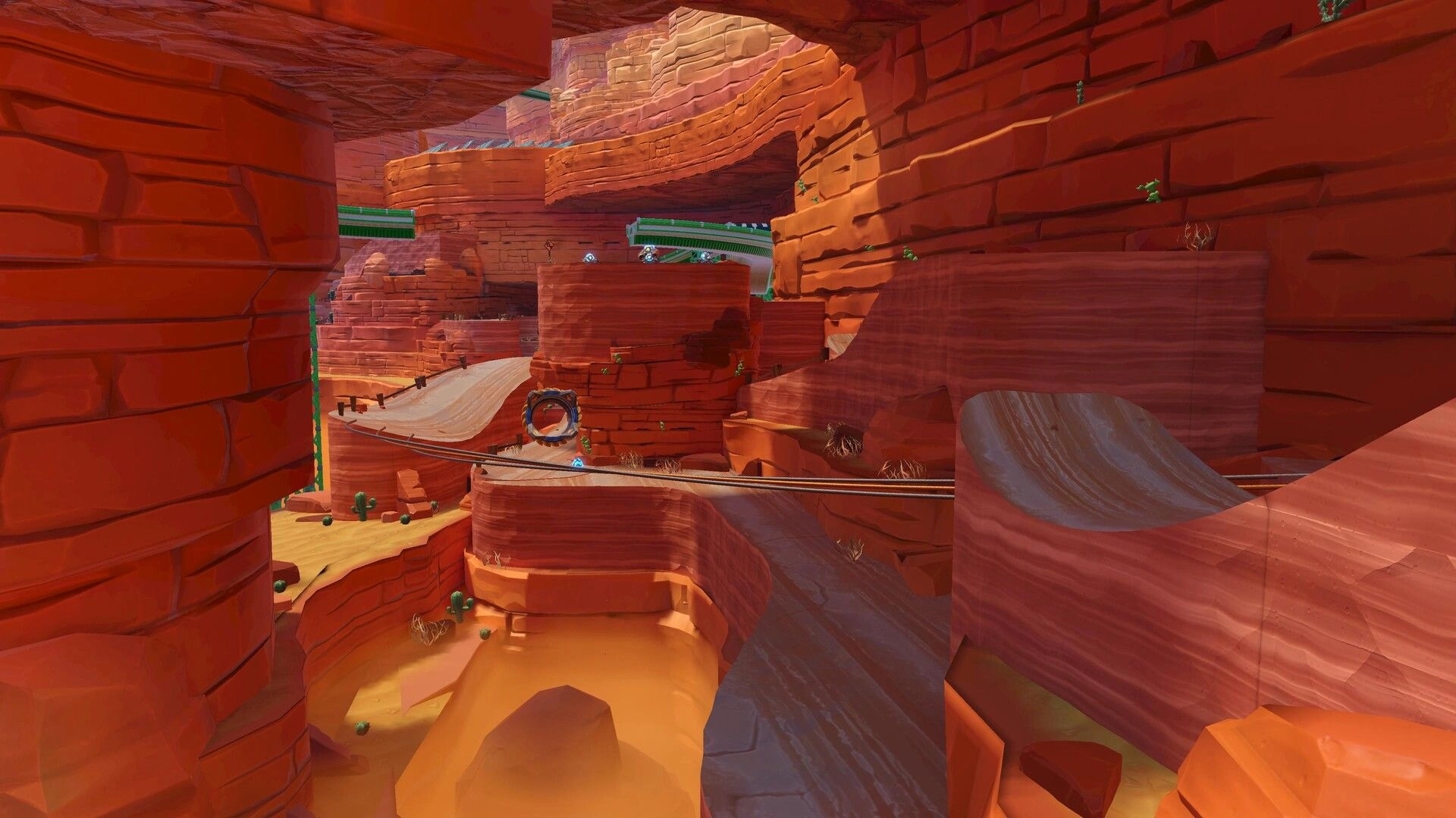 Rollin' Rascal: Curving rail track and ramp platforms winding through a red rock canyon level.