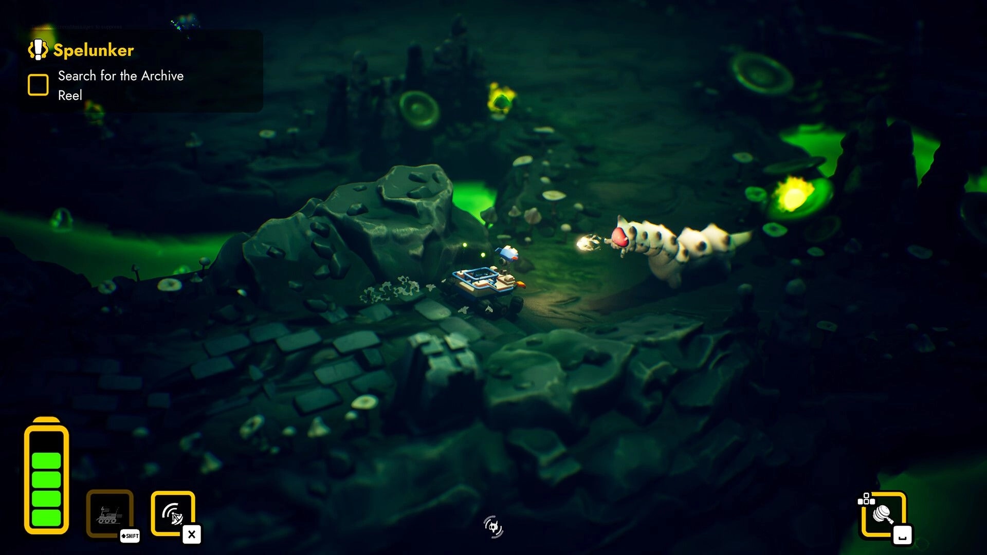 Rover’s Tale: Rover fires at a segmented worm enemy in a green-glowing cave with Spelunker quest UI.