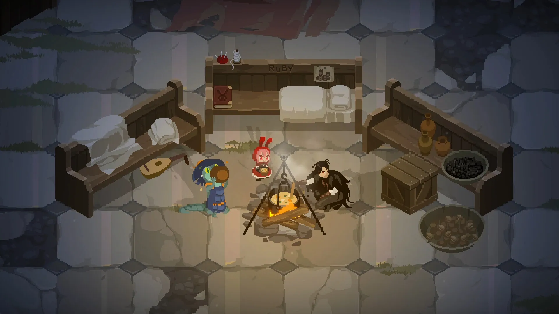 Rubinite: Ruby and companions gather around a campfire in a stone-floored room with benches and supplies.