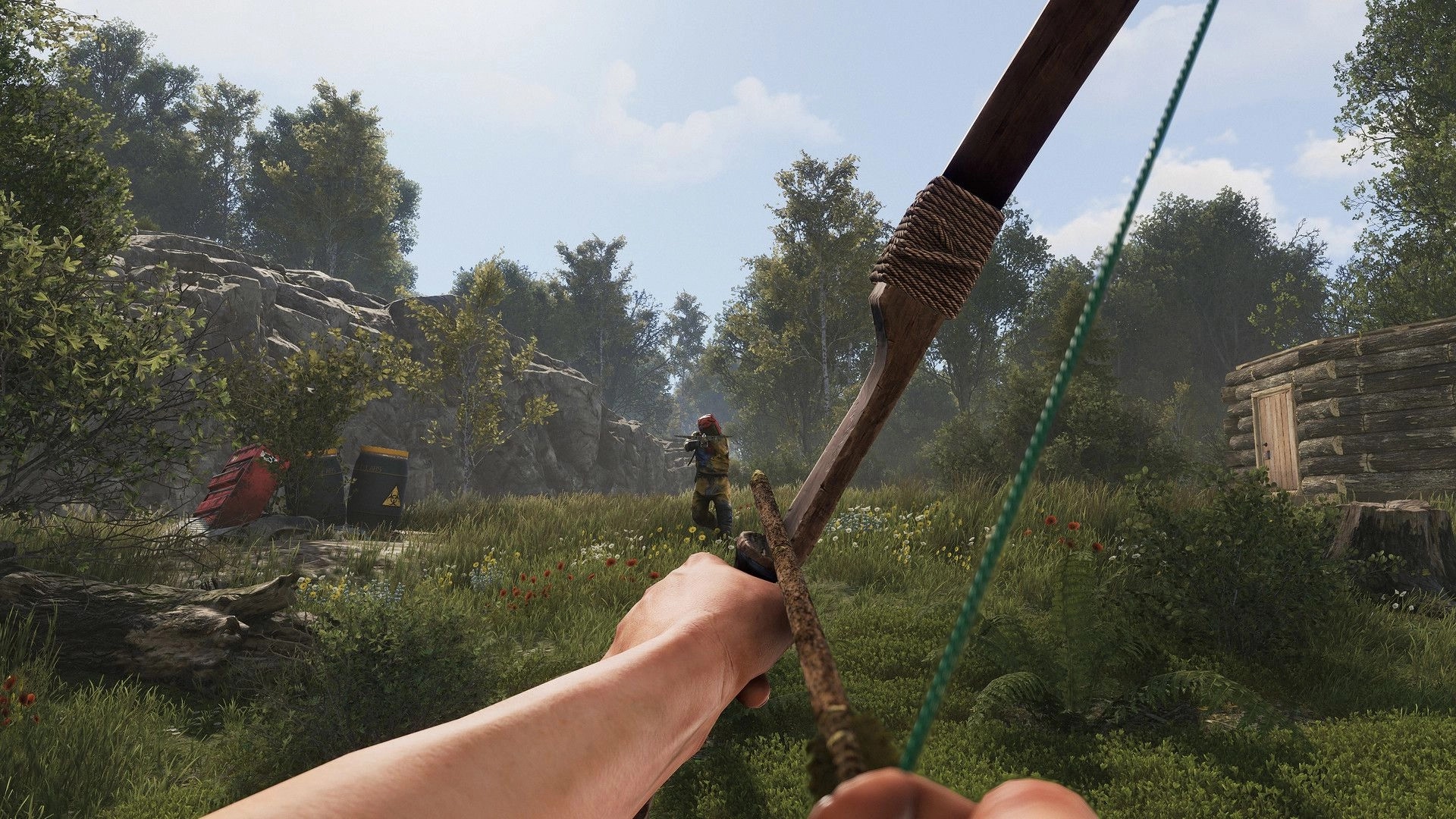 Rust: First-person aiming with bow at player in forest near wooden cabin and barrels