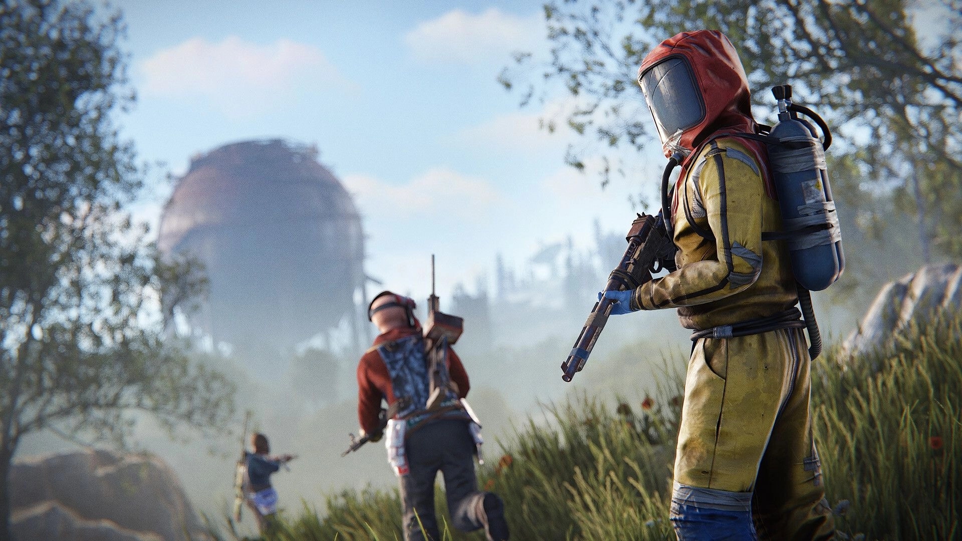 Rust: Three players in hazmat suits explore grassy field near a large, rusted dome structure