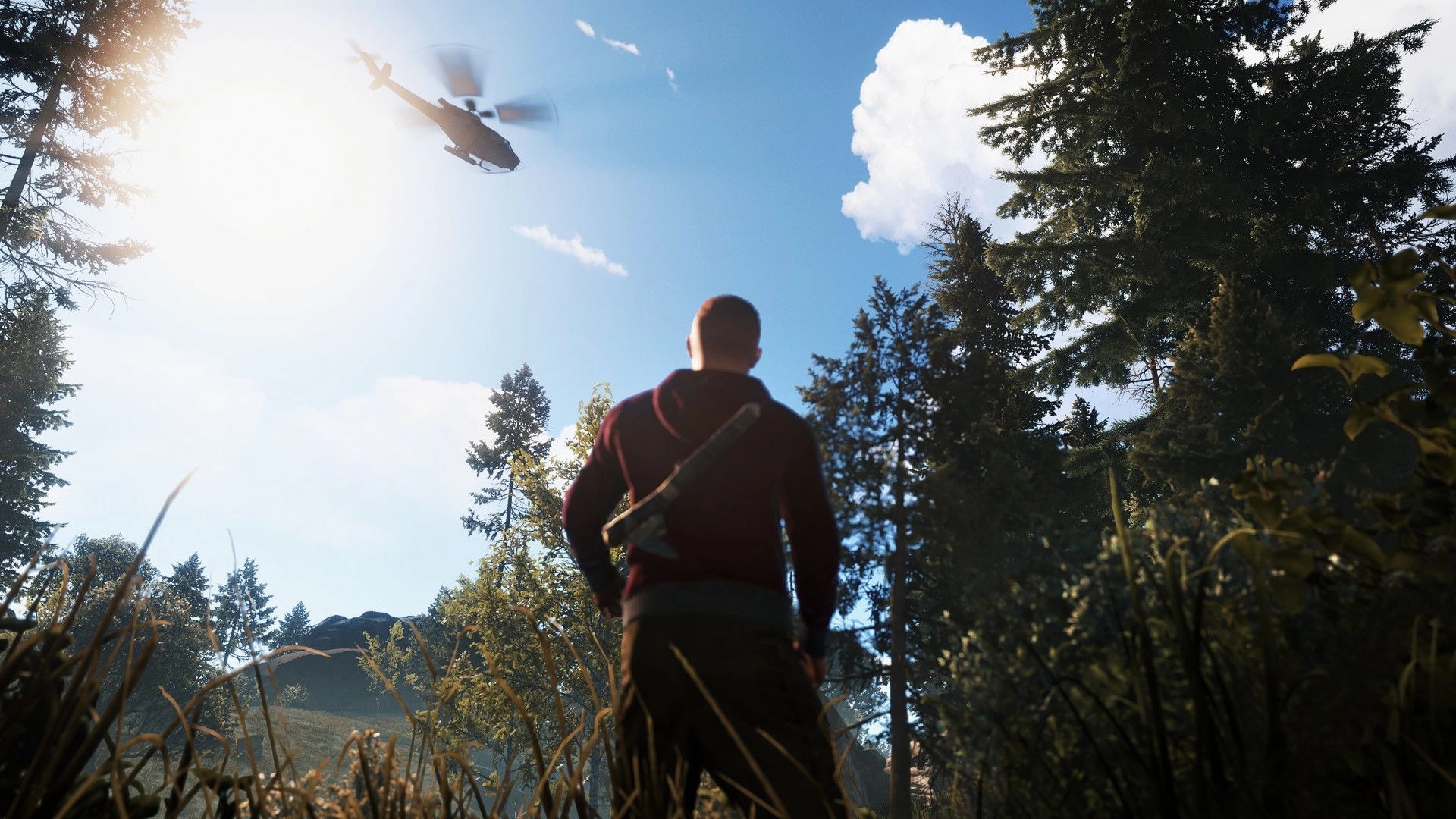 Rust: Player with axe watches helicopter fly over forested landscape in sunny weather