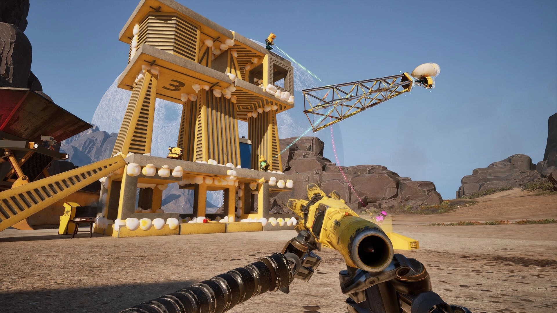 Salvation Denied: First-person tool aims at crane truss beside foam-covered tower in rocky yard.