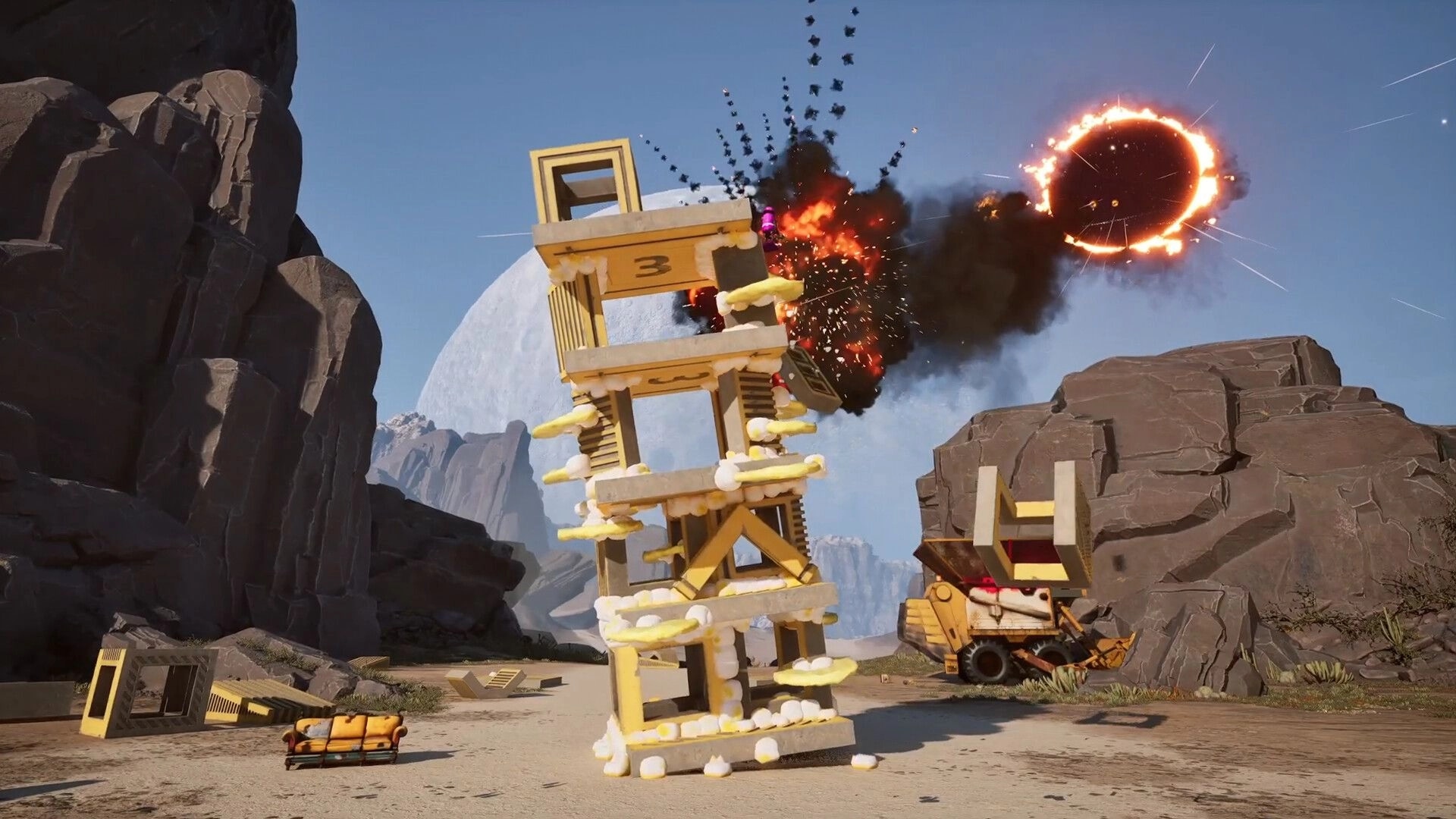 Salvation Denied: Wobbly block tower collapses as a fiery blast erupts in a rocky canyon yard.