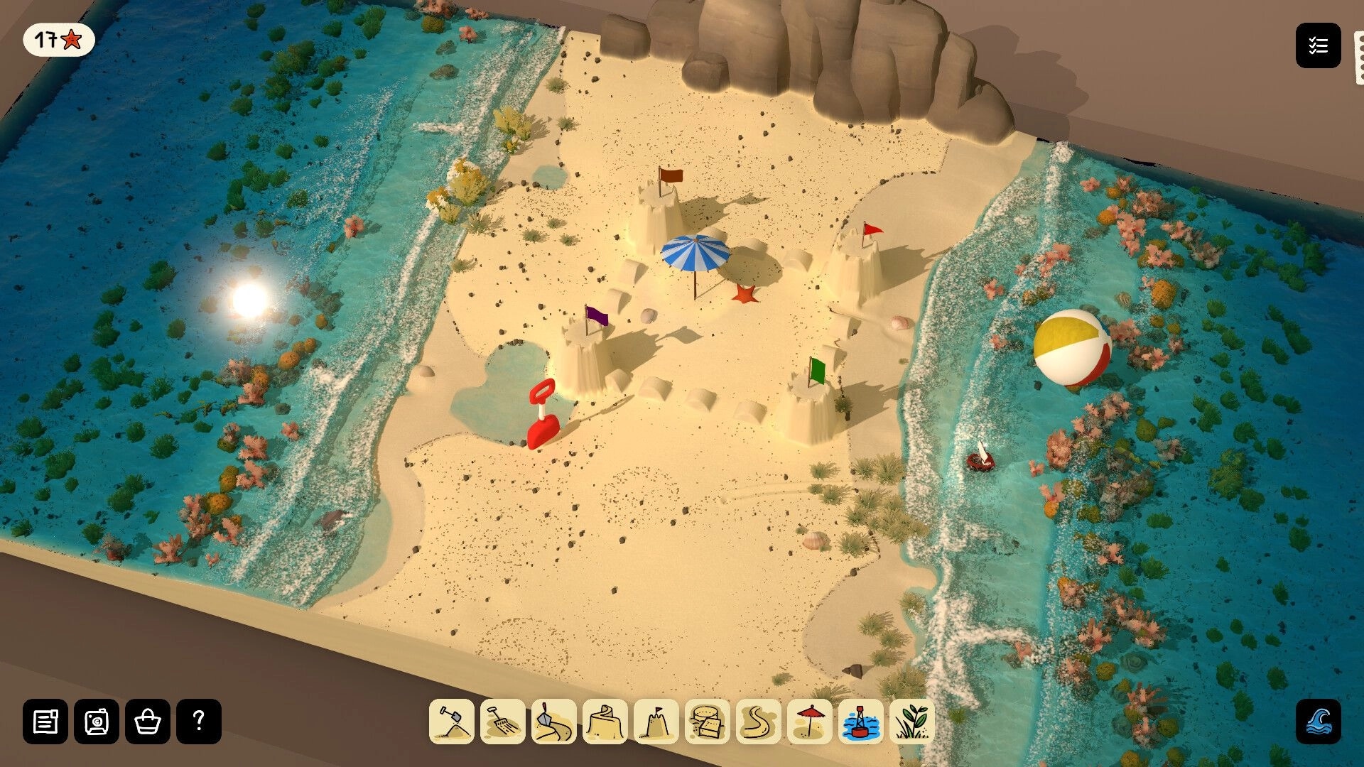 Sandcastle: Building sand towers with flags and umbrella on sandy cove, tool icons and 17-star UI.