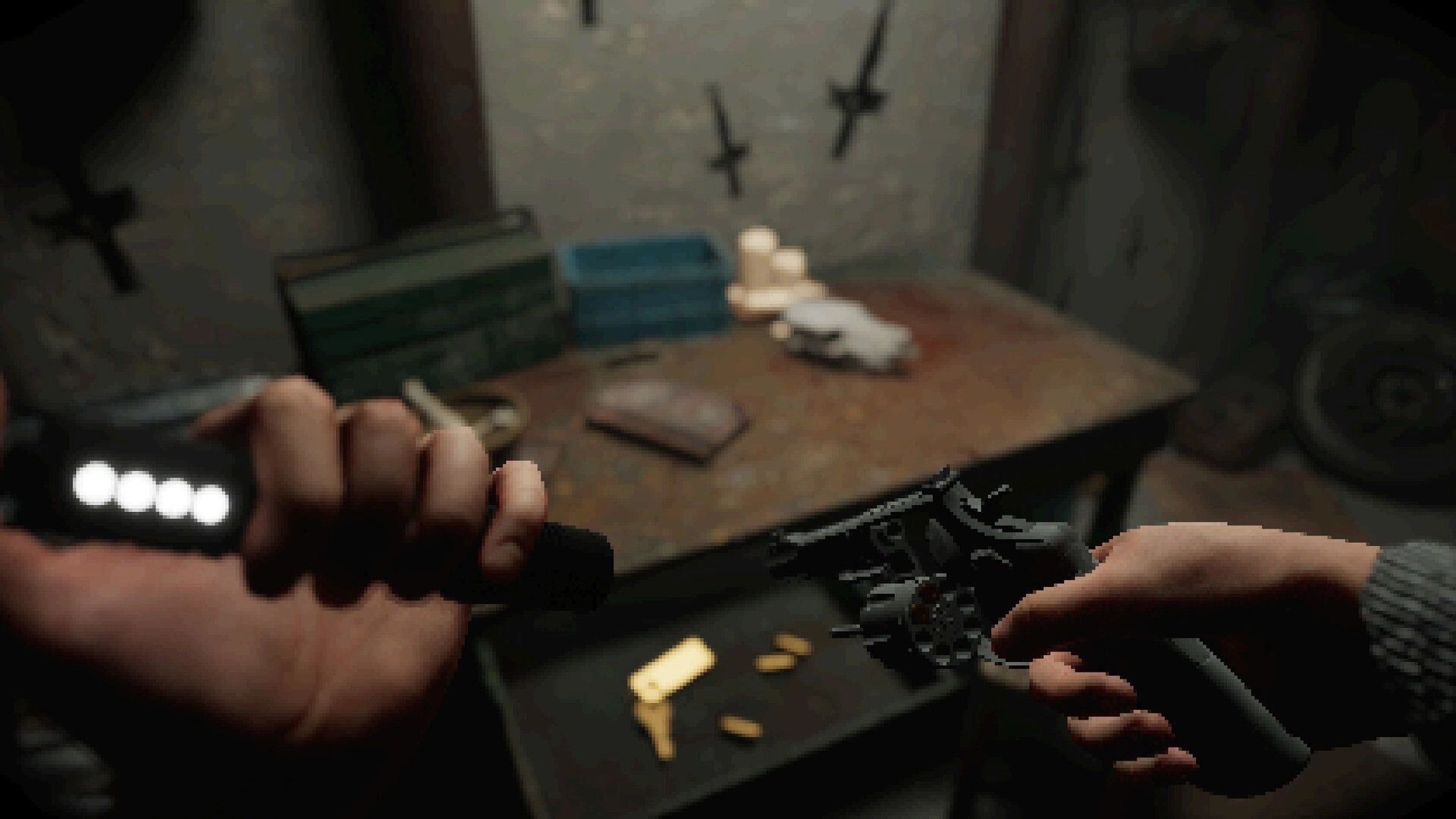 Satanic: Player loading revolver in dimly lit bunker room with scattered items on a metal table
