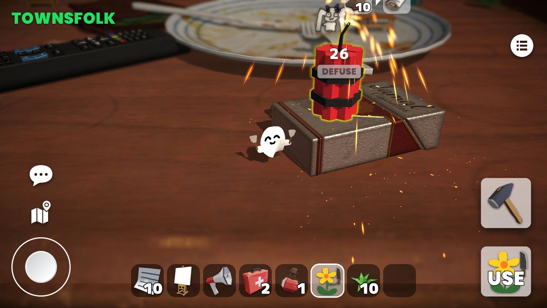 Scribble Wolf: Defuse prompt over a sparking bomb on a gift box on a tabletop with item hotbar UI.