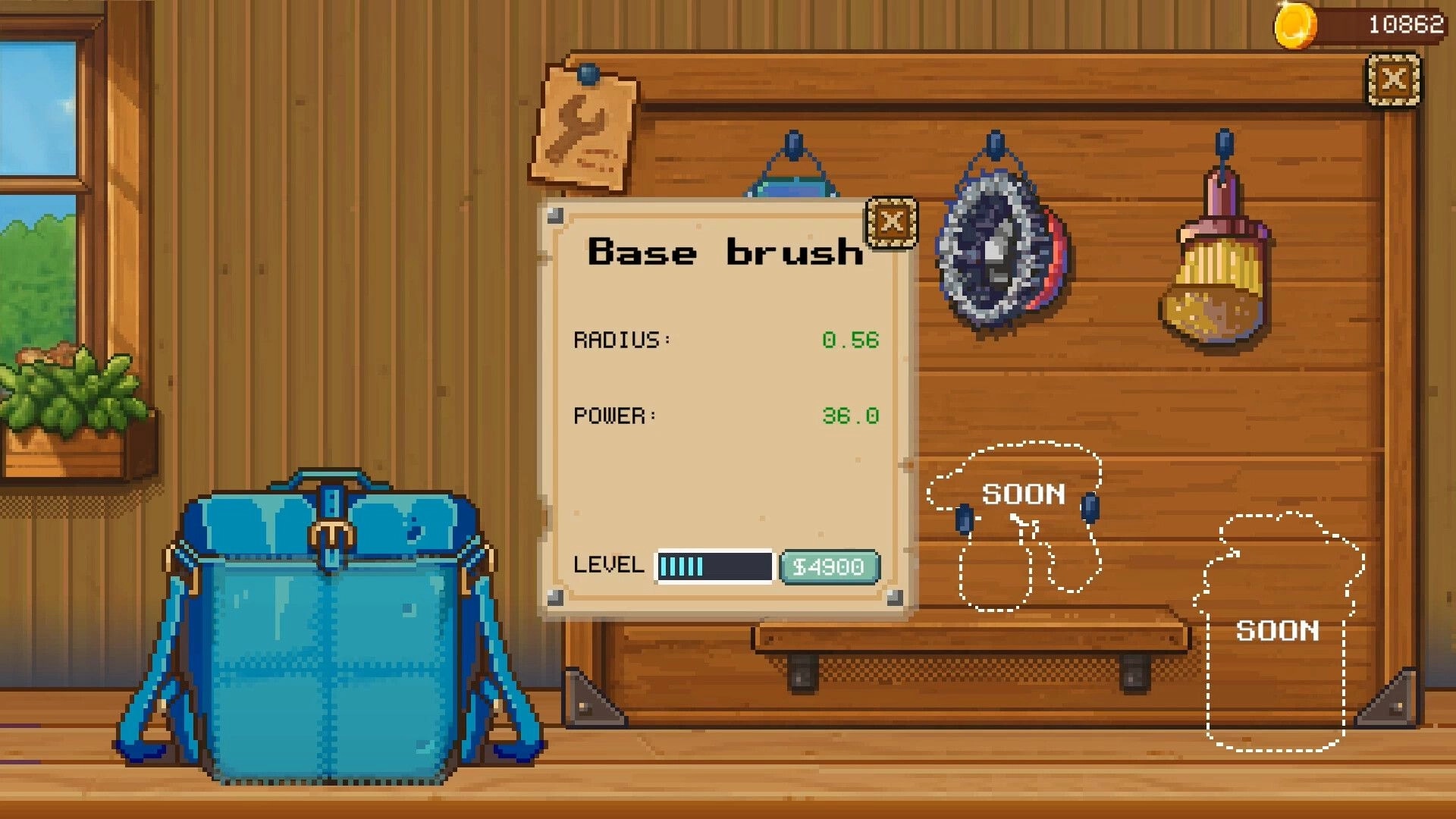 Seaside Wash: Base brush upgrade menu with radius and power stats in a wooden workshop wall display.