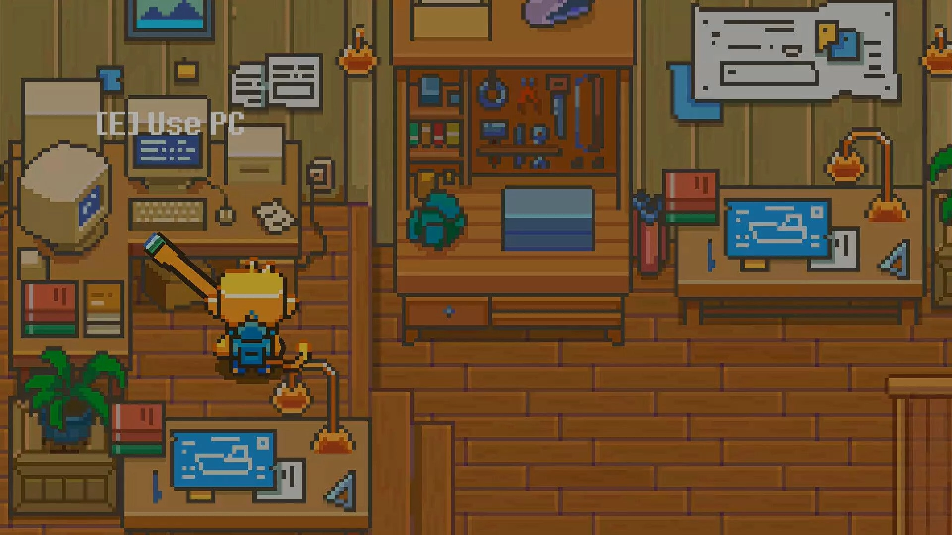Seaside Wash: Player stands by a desk with prompt to use PC inside a cozy wooden workshop office.