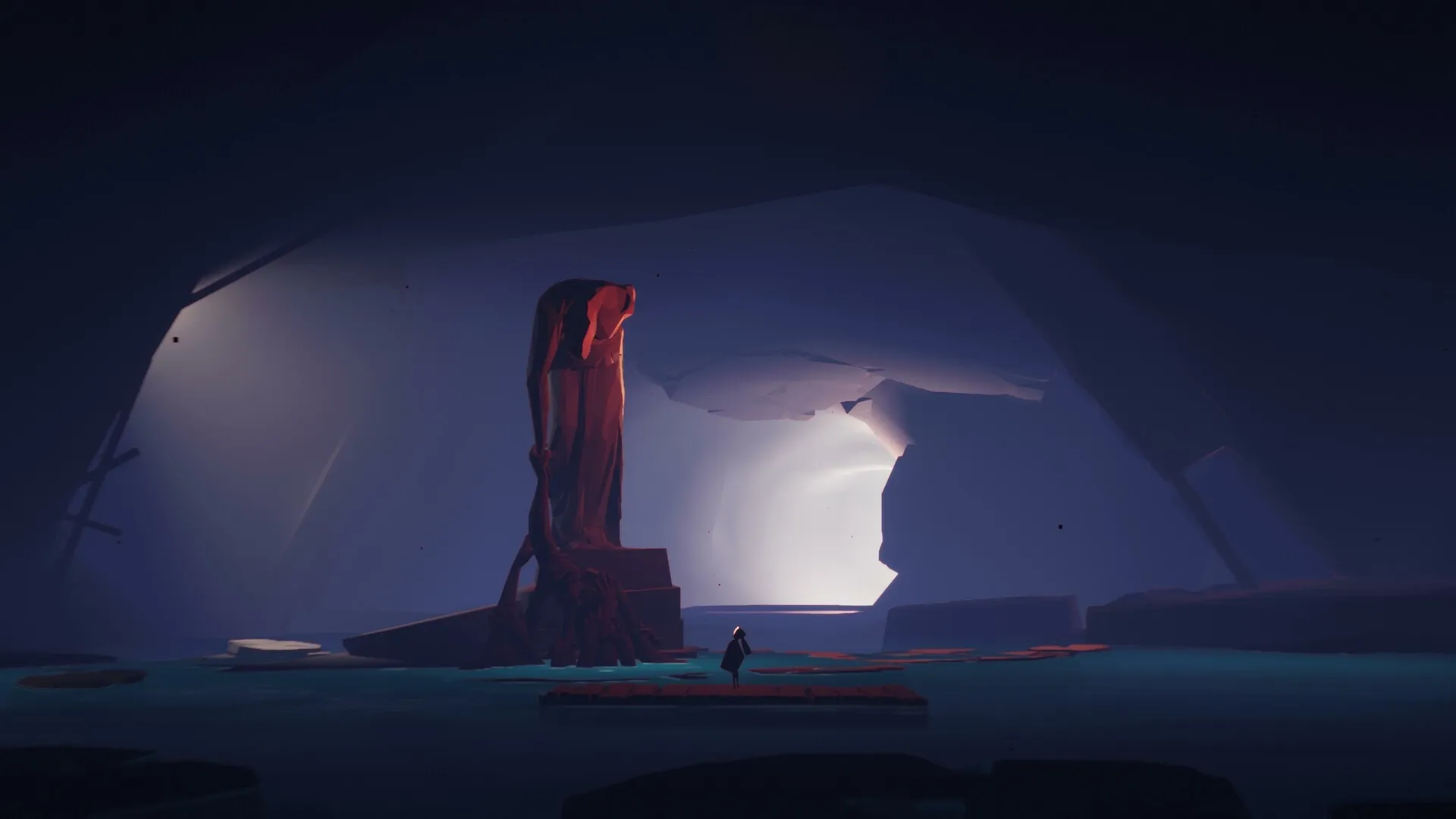 SELINI: Lone figure stands before towering red statue in dimly lit cavern with glowing cave entrance