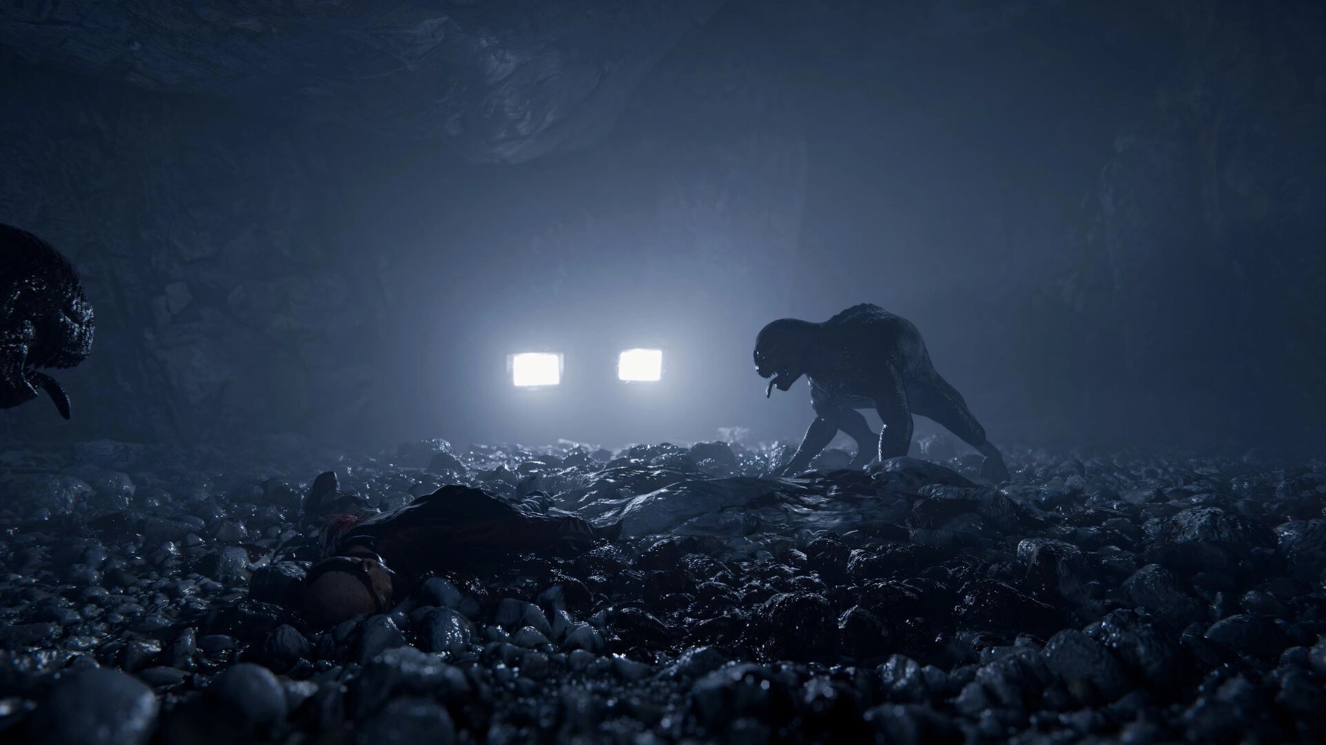 Shadow Project: Creature prowling dim cave with headlights illuminating rocky ground, body lying nearby