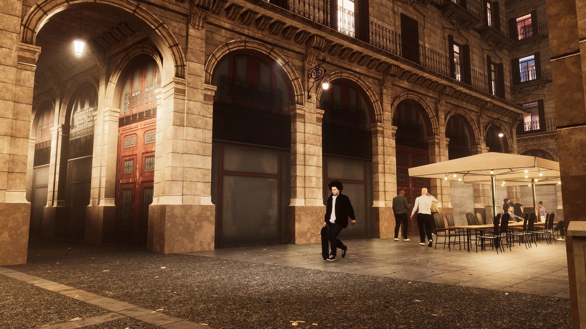 Skate Style: Skater walks holding a board past café tables under arches in a lit stone plaza at night.