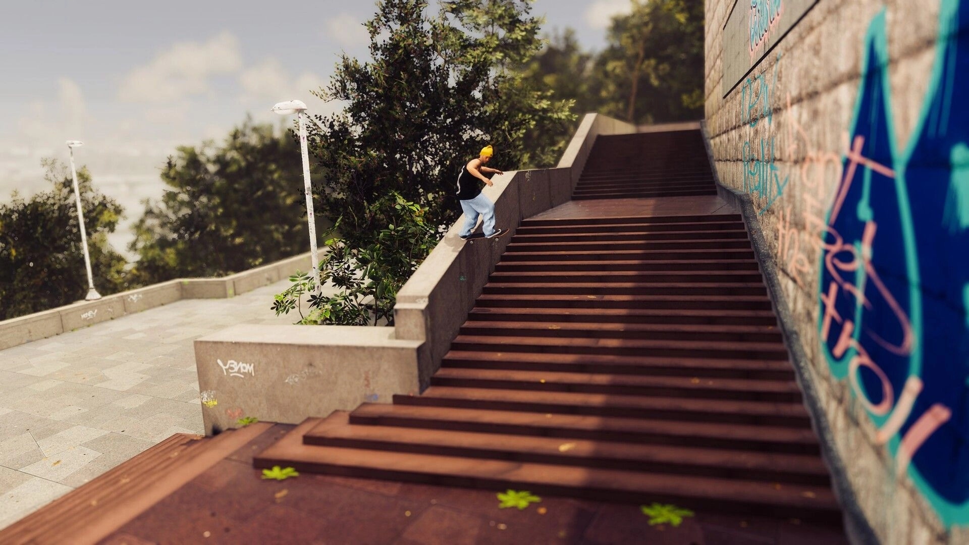 Skate Style: Skater grinding a concrete ledge beside long stairs in a graffiti-lined urban plaza.