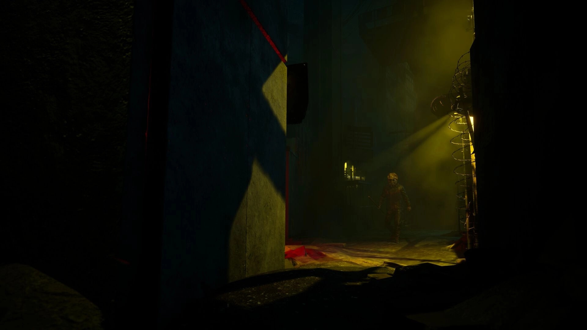 SLEEP AWAKE: Character in gas mask cautiously approaches barbed wire in dimly lit alleyway.
