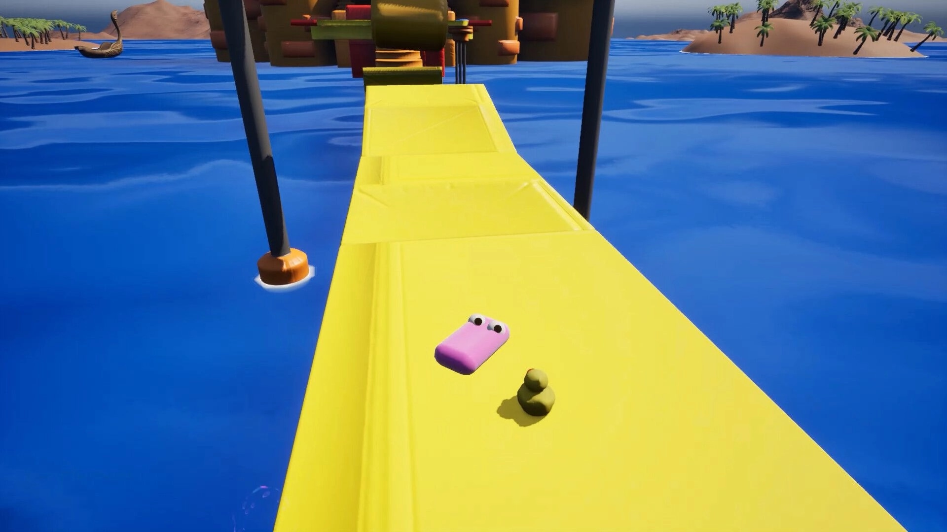 Soap Slide: Pink soap character sliding on a yellow track over water with distant islands visible