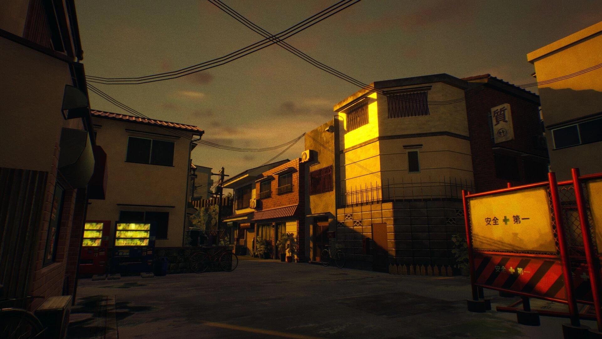 SOMBRAS: Empty residential street with vending machines and safety barrier under tangled power lines at dusk.