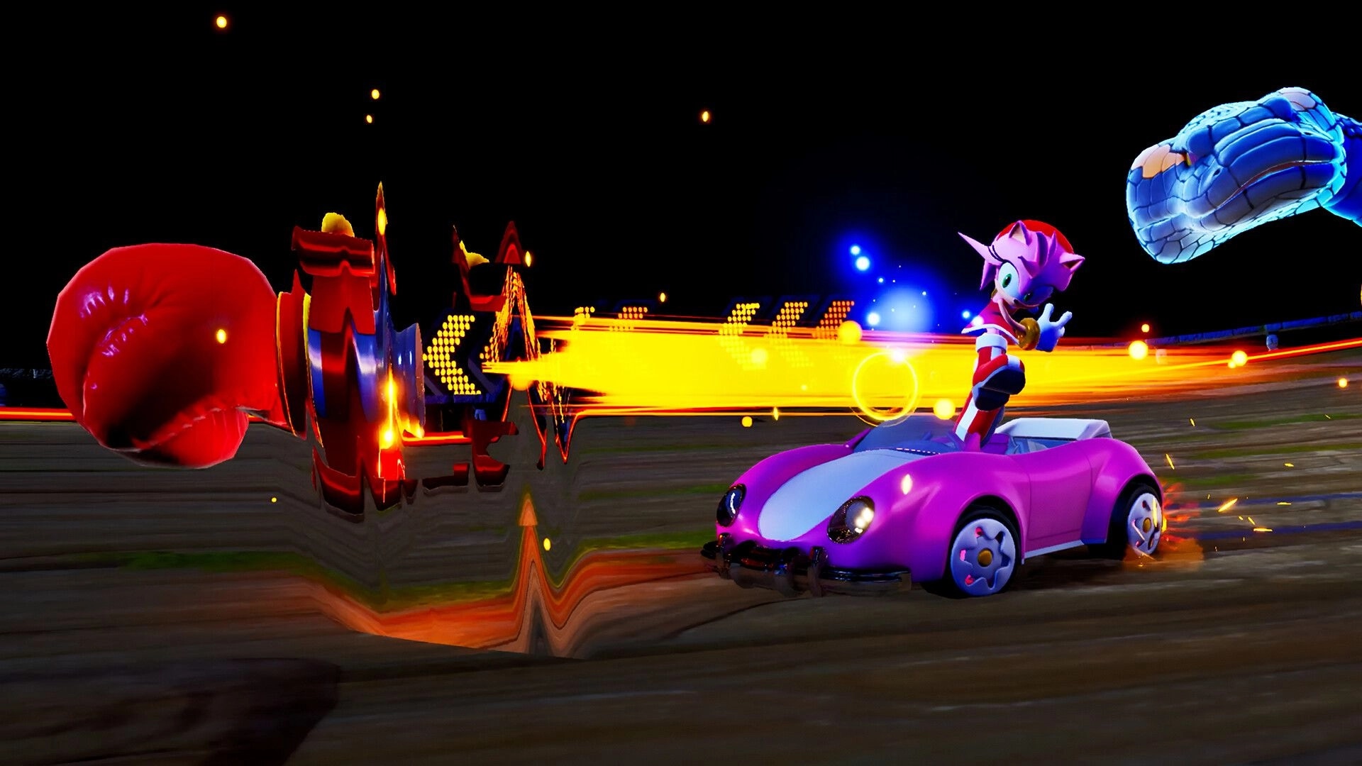 Sonic Racing: Amy Rose evading a giant boxing glove in a vibrant race track environment
