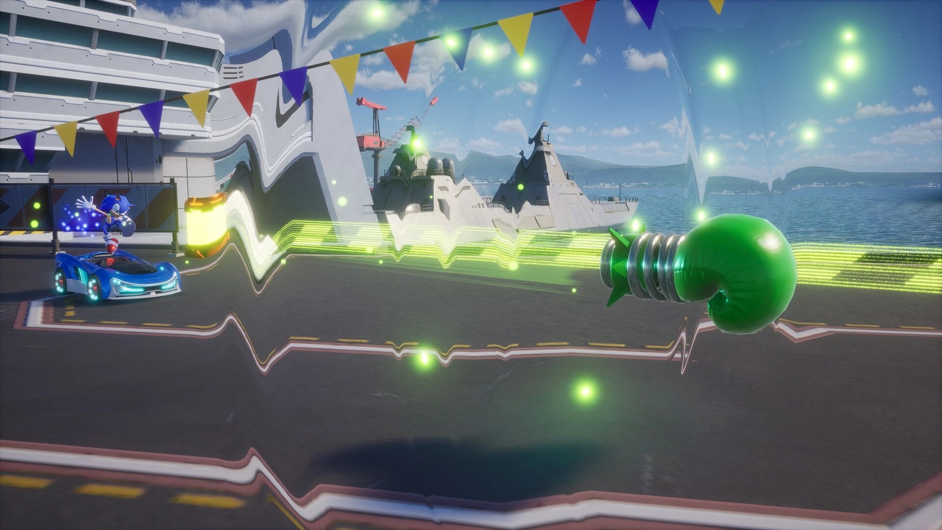 Sonic Racing: Sonic on a blue car with energy waves and a green power-up on aircraft carrier deck