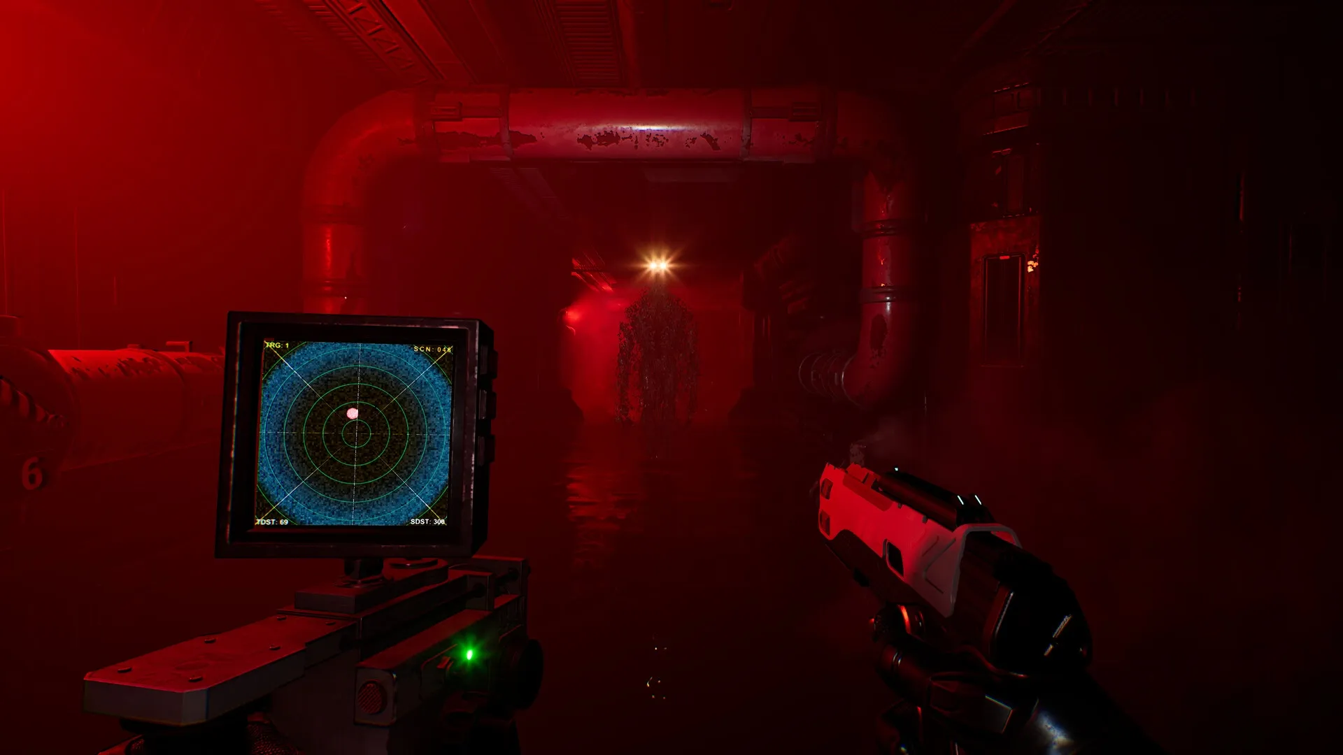 Species: Player aiming gun in dark, red-lit corridor with radar display and creature ahead