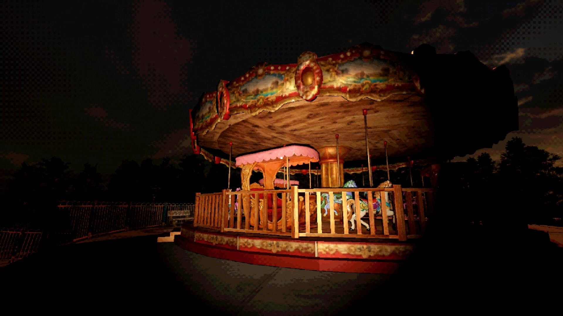 Spooky Fun Park: Flashlight-lit carousel ride with fenced platform in a dark, empty amusement park at night.