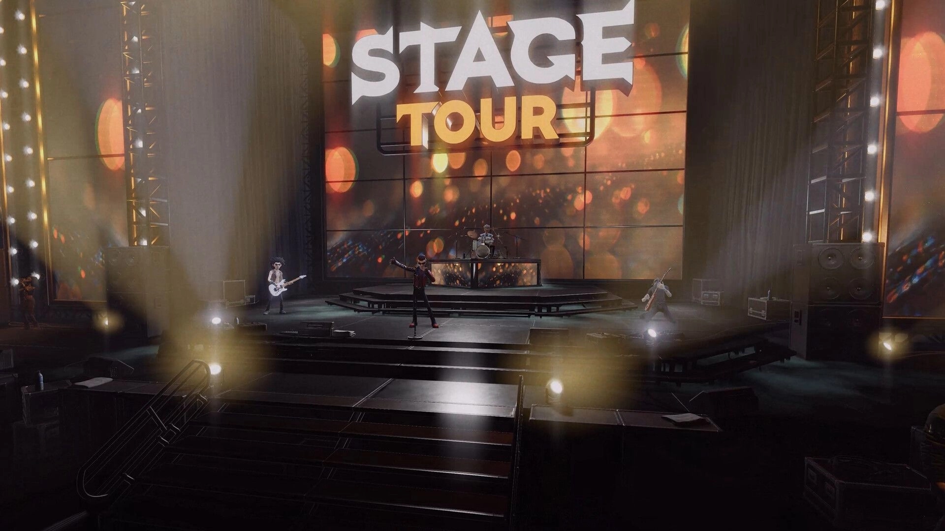 STAGE TOUR: Band performs on a lit concert stage with huge STAGE TOUR logo on the backdrop screen.