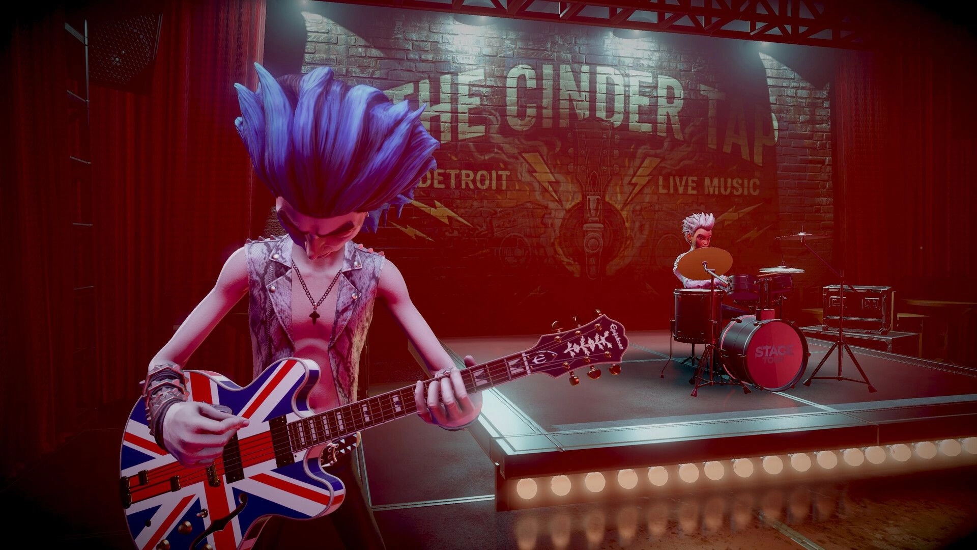 STAGE TOUR: Punk guitarist strums Union Jack Epiphone as drummer plays on a small club stage backdrop.