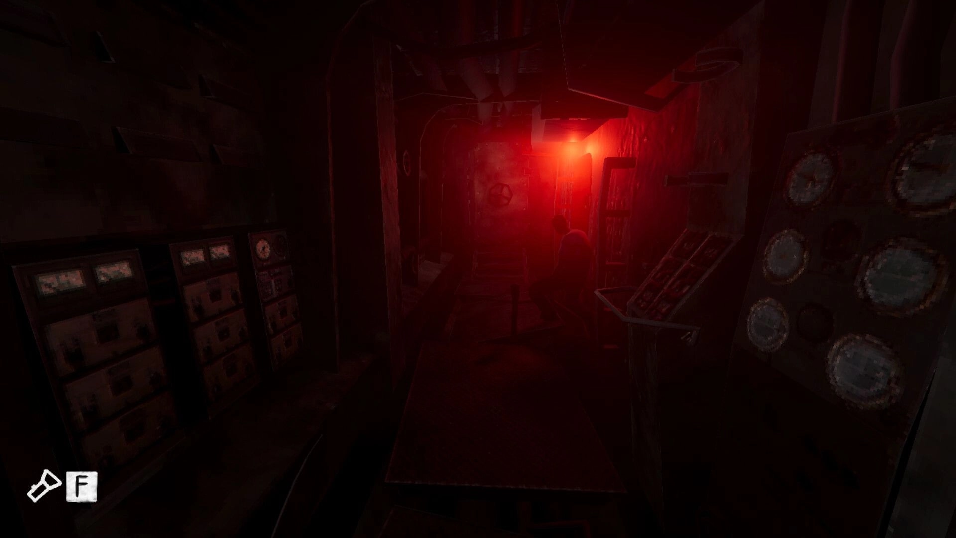 Static Dread: Crew member crouching in dim, red-lit submarine corridor with control panels and door wheel